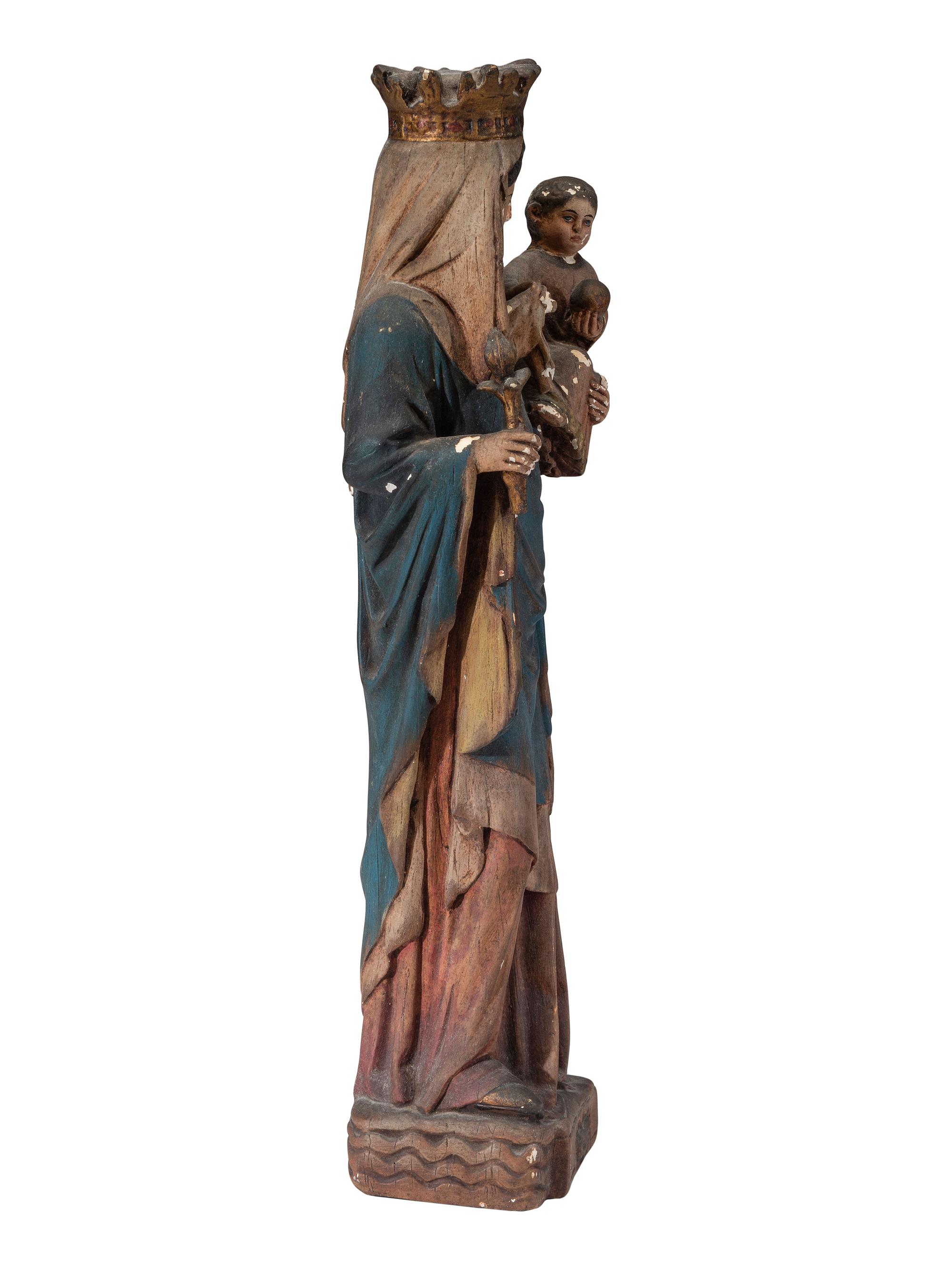 A Continental Paint Decorated Chalkware Santos Figure of the Madonna and Child