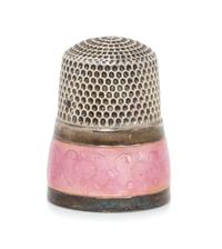 An American Silver and Guilloche Enamel Thimble, Simons Bros., Philadelphia, PA, the knurled top and body above a pink guilloche enamel