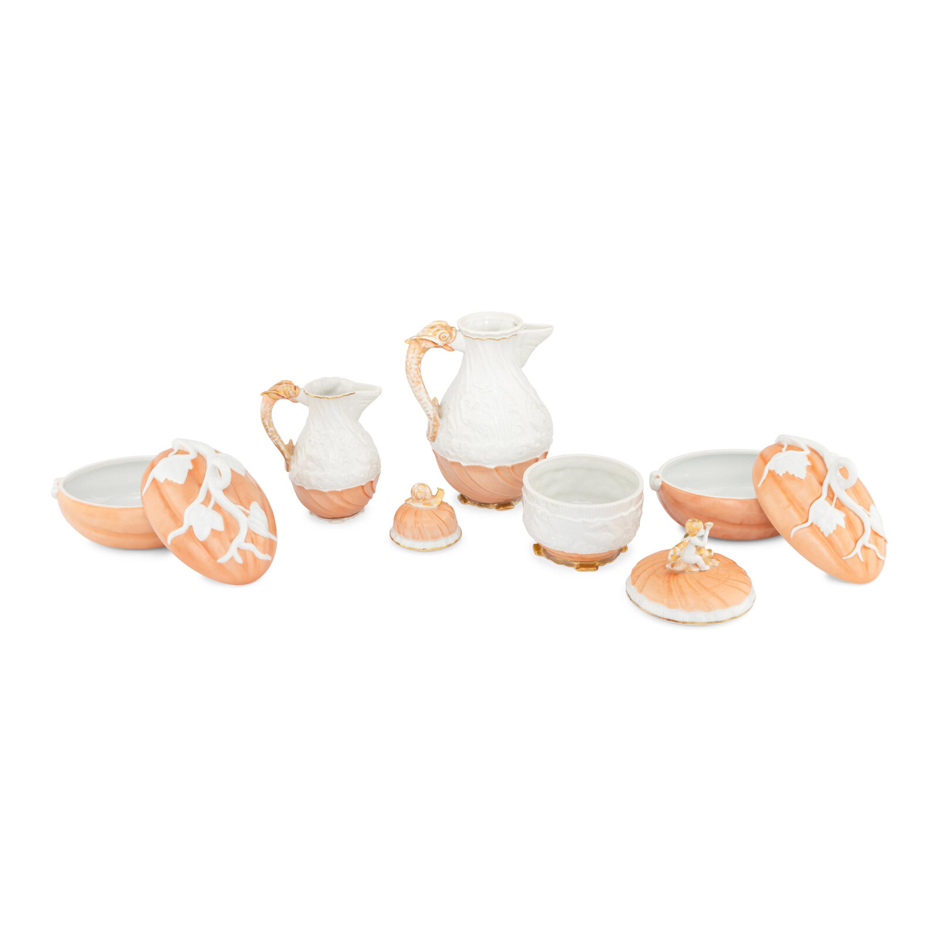 A Collection of Mottahedeh Salmon Porcelain Table Articles