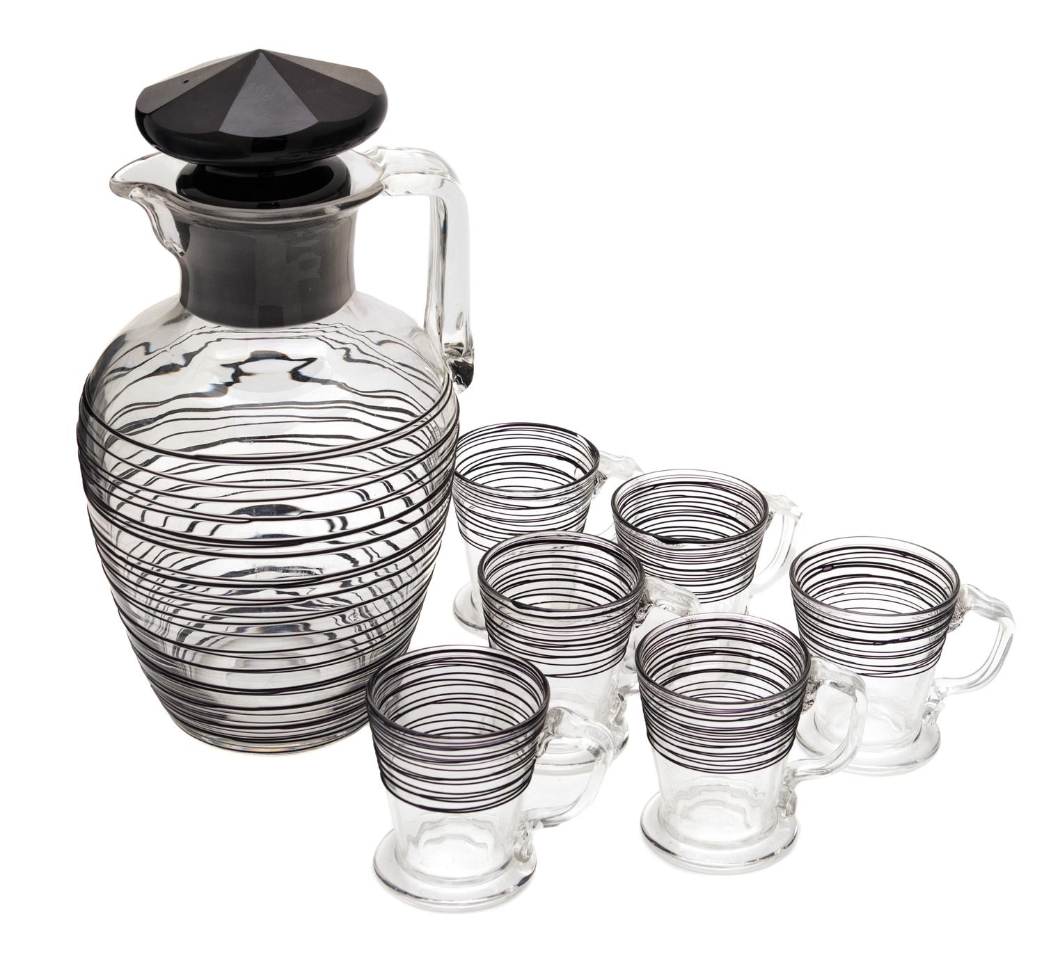 Steuben, , a black threaded-glass water pitcher with 6 small cups