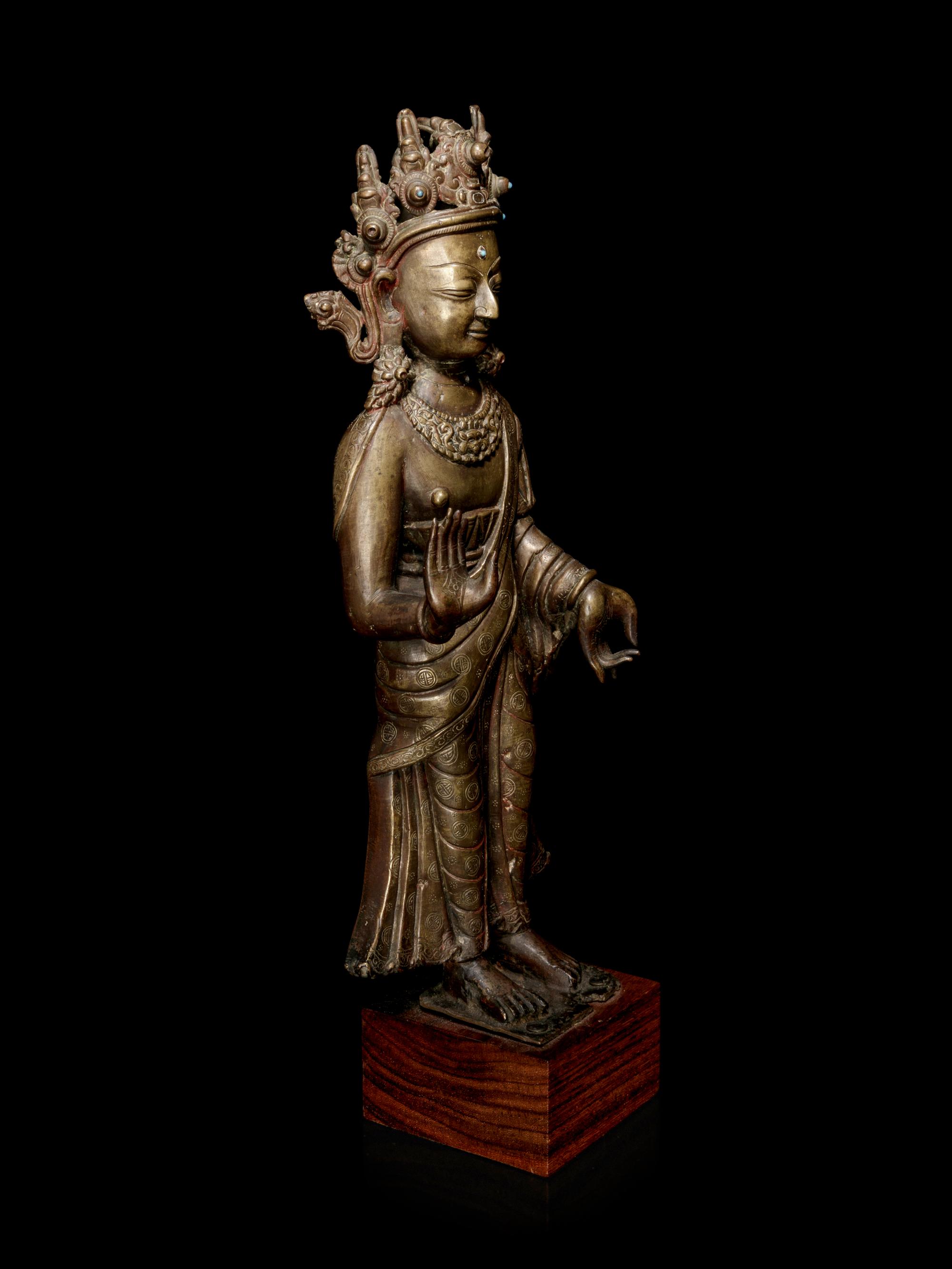 A Large Tibetan Gilt Bronze Figure of Buddha Dipankara