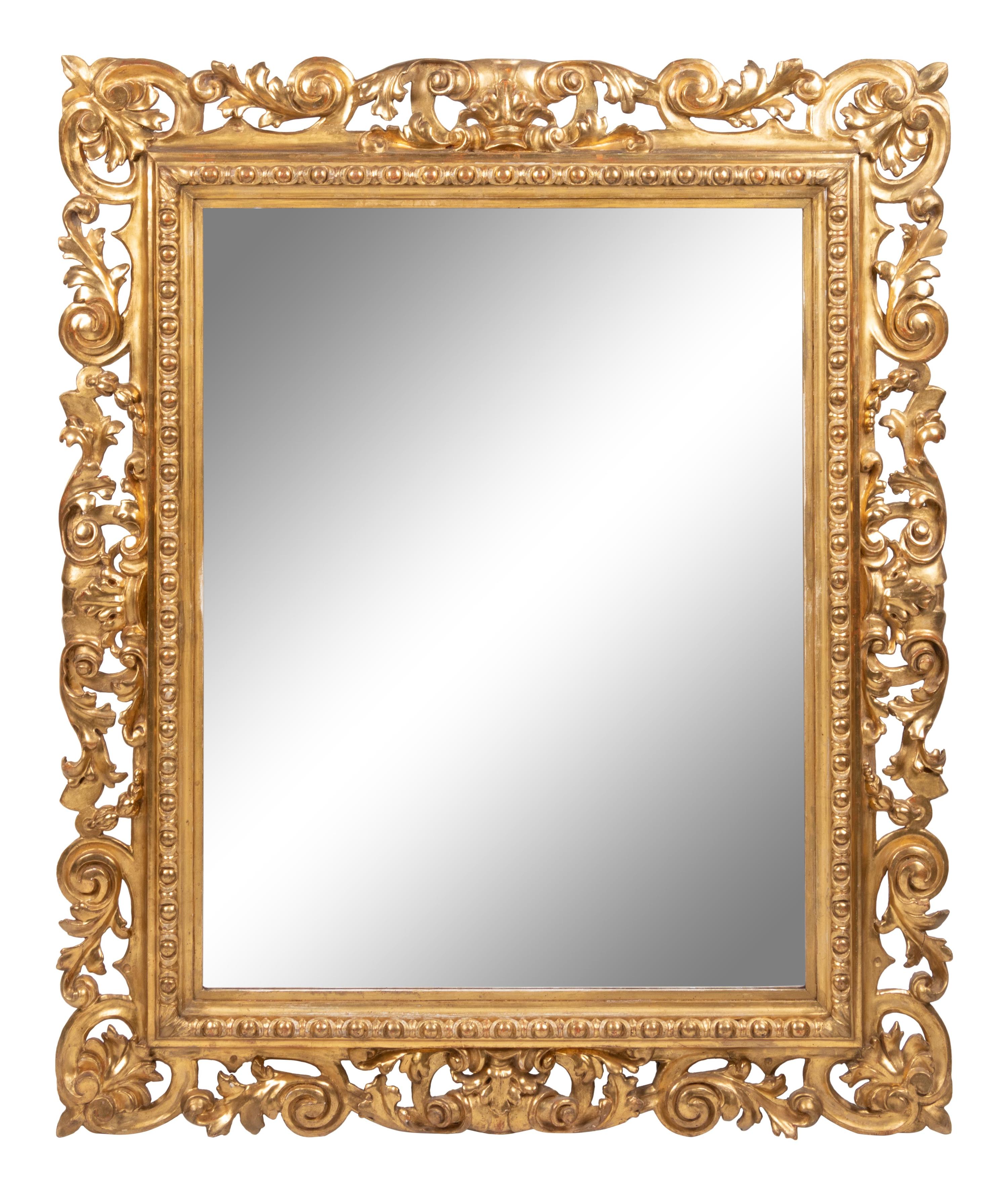 An Italian Baroque Style Giltwood Mirror