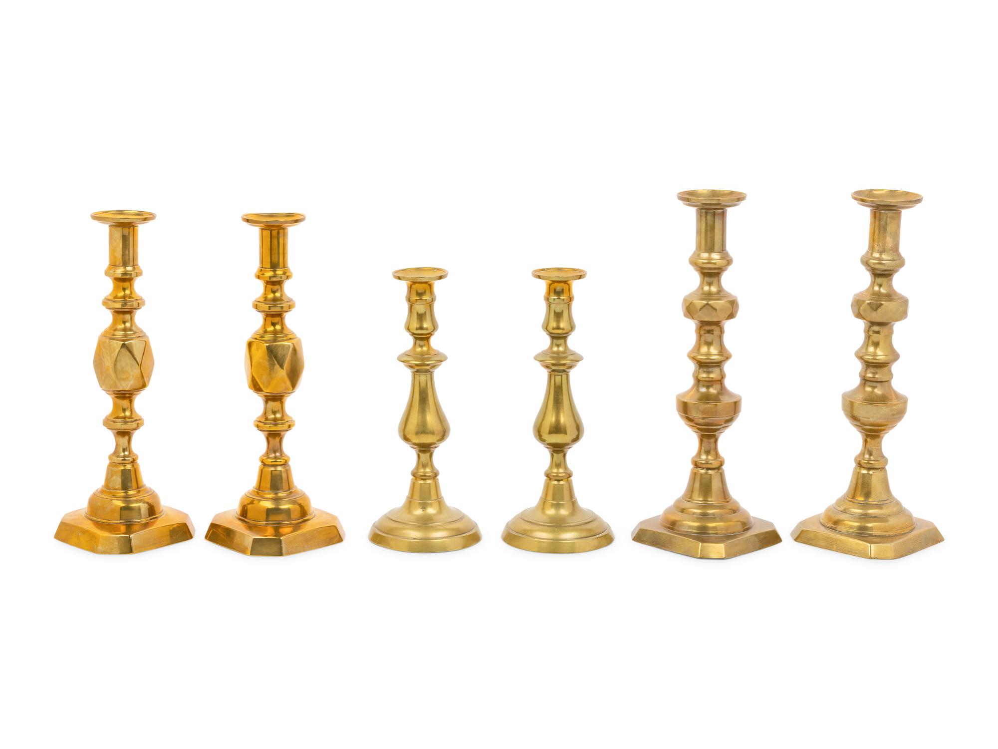 Three Pairs of English Brass Candlesticks