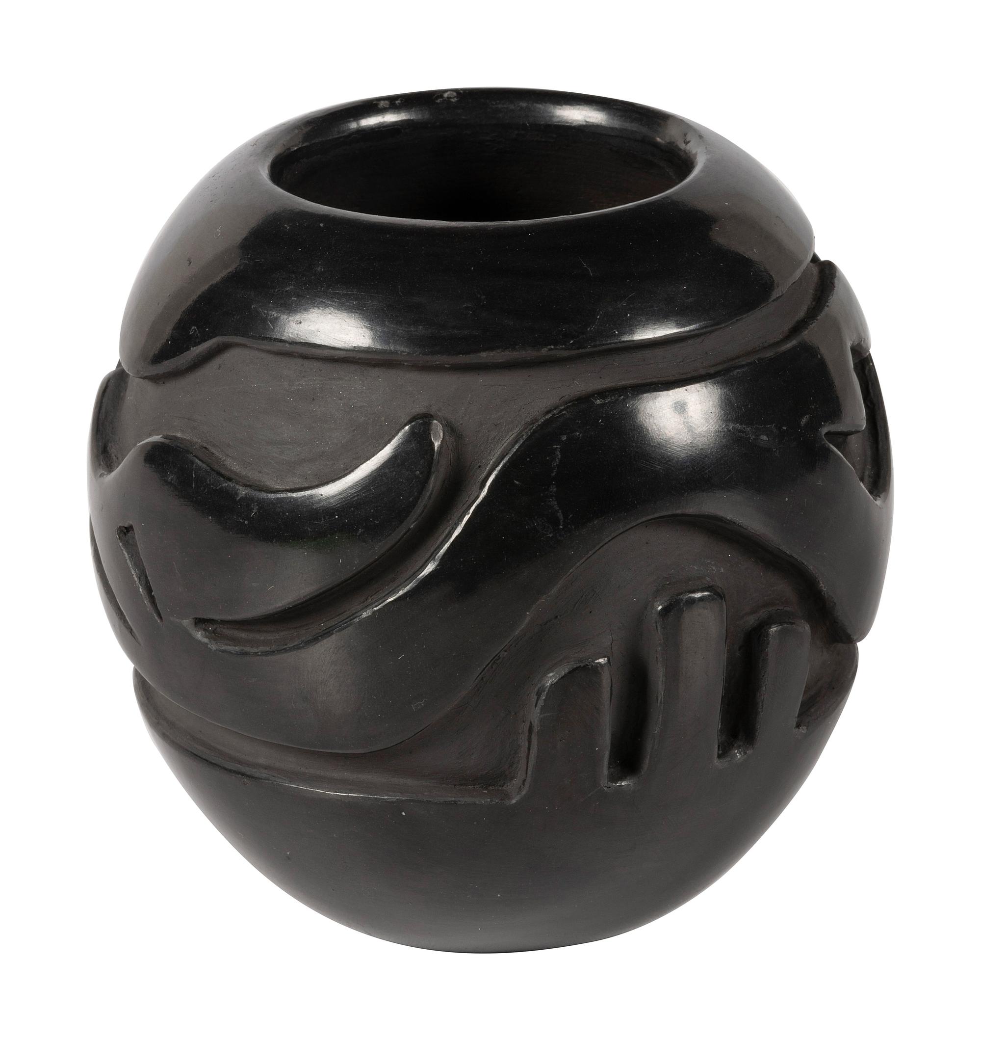 Deeply Carved Blackware Pottery Jar, with Avanyu