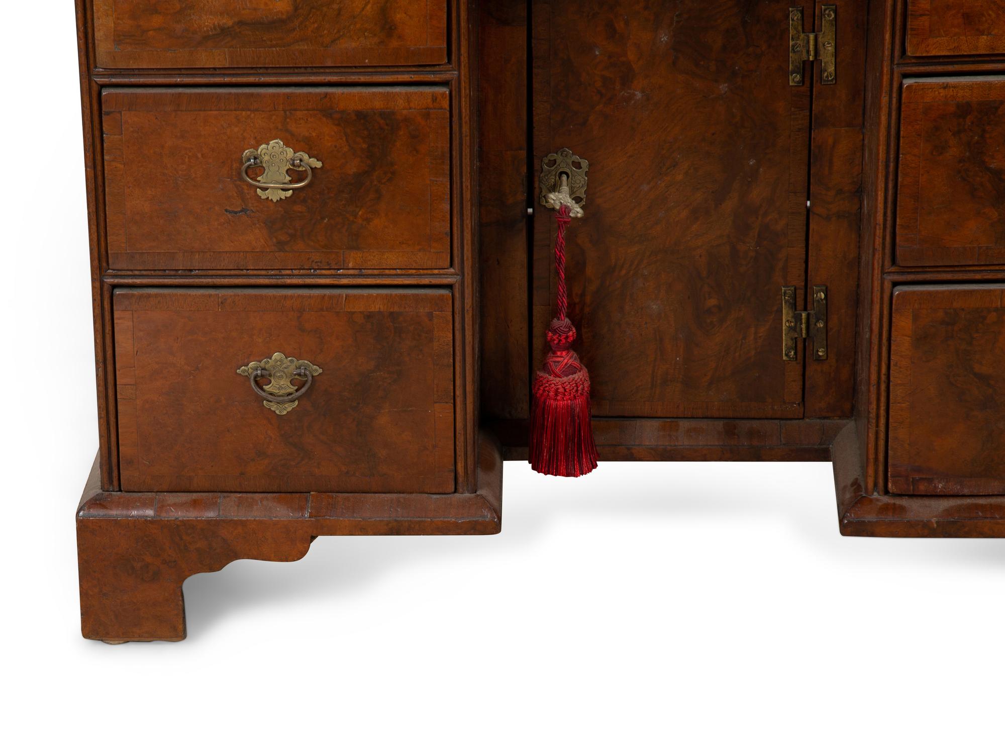 A George II Style Burl Walnut Kneehole Desk — 19TH CENTURY