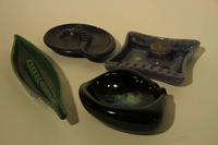 A Collection of Thirteen Haeger Pottery Ash Receivers Width of widest 18 1/2 inches.