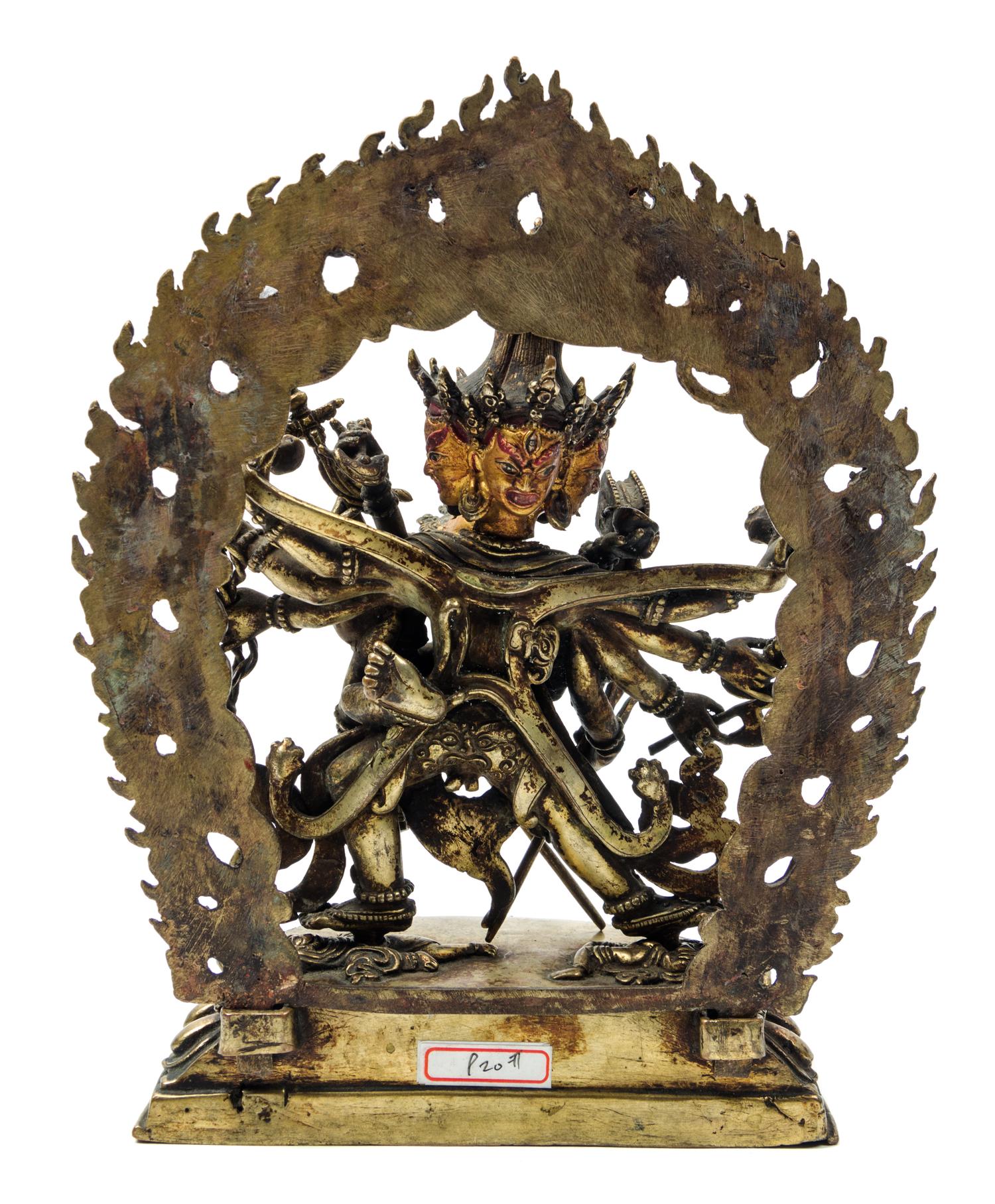 A Sino-Tibetan Gilt Bronze Figure of a Multi-Head Deity