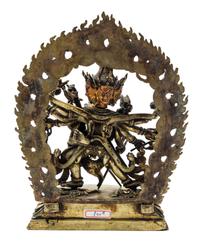 A Sino-Tibetan Gilt Bronze Figure of a Multi-Head Deity