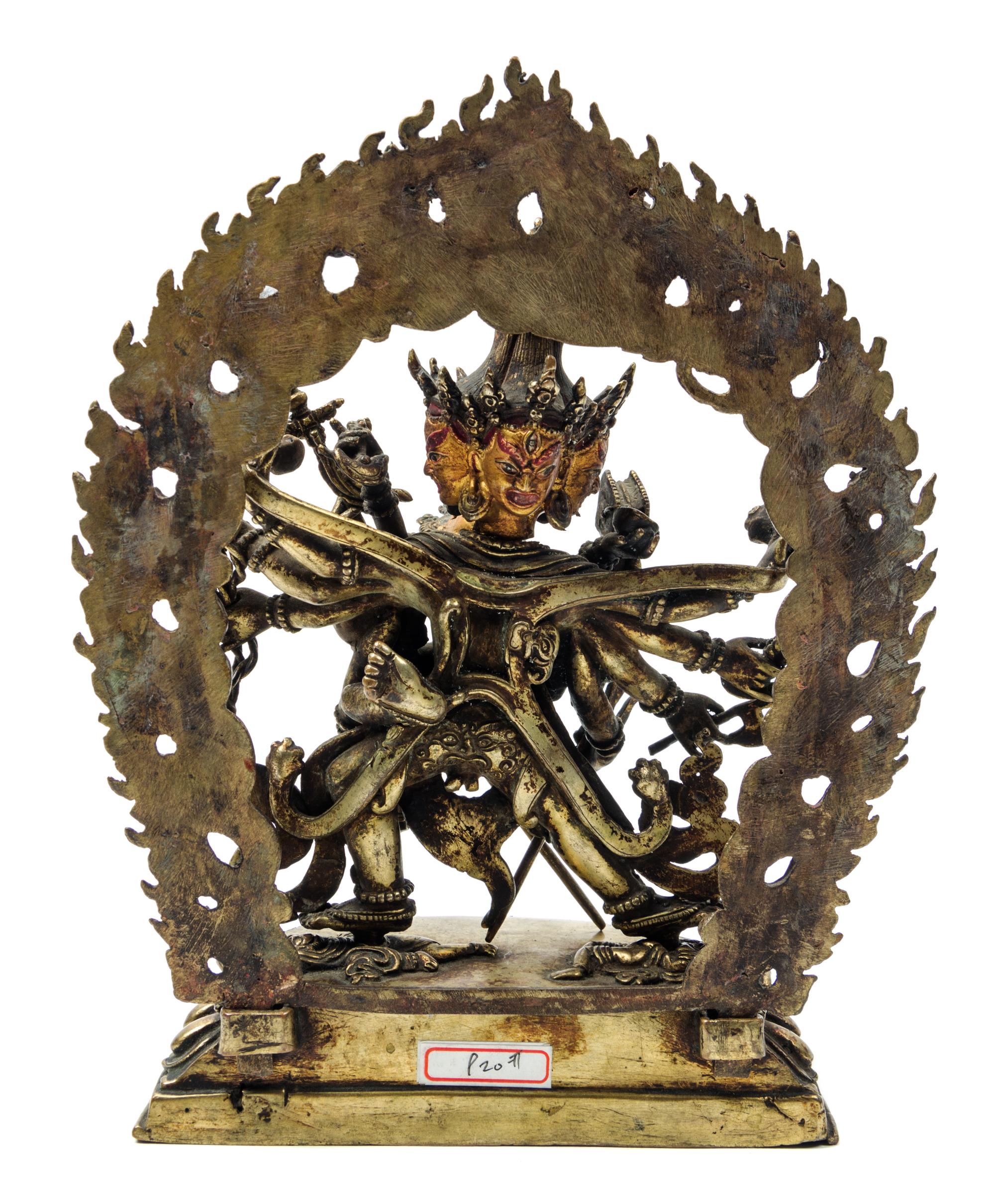 A Sino-Tibetan Gilt Bronze Figure of a Multi-Head Deity