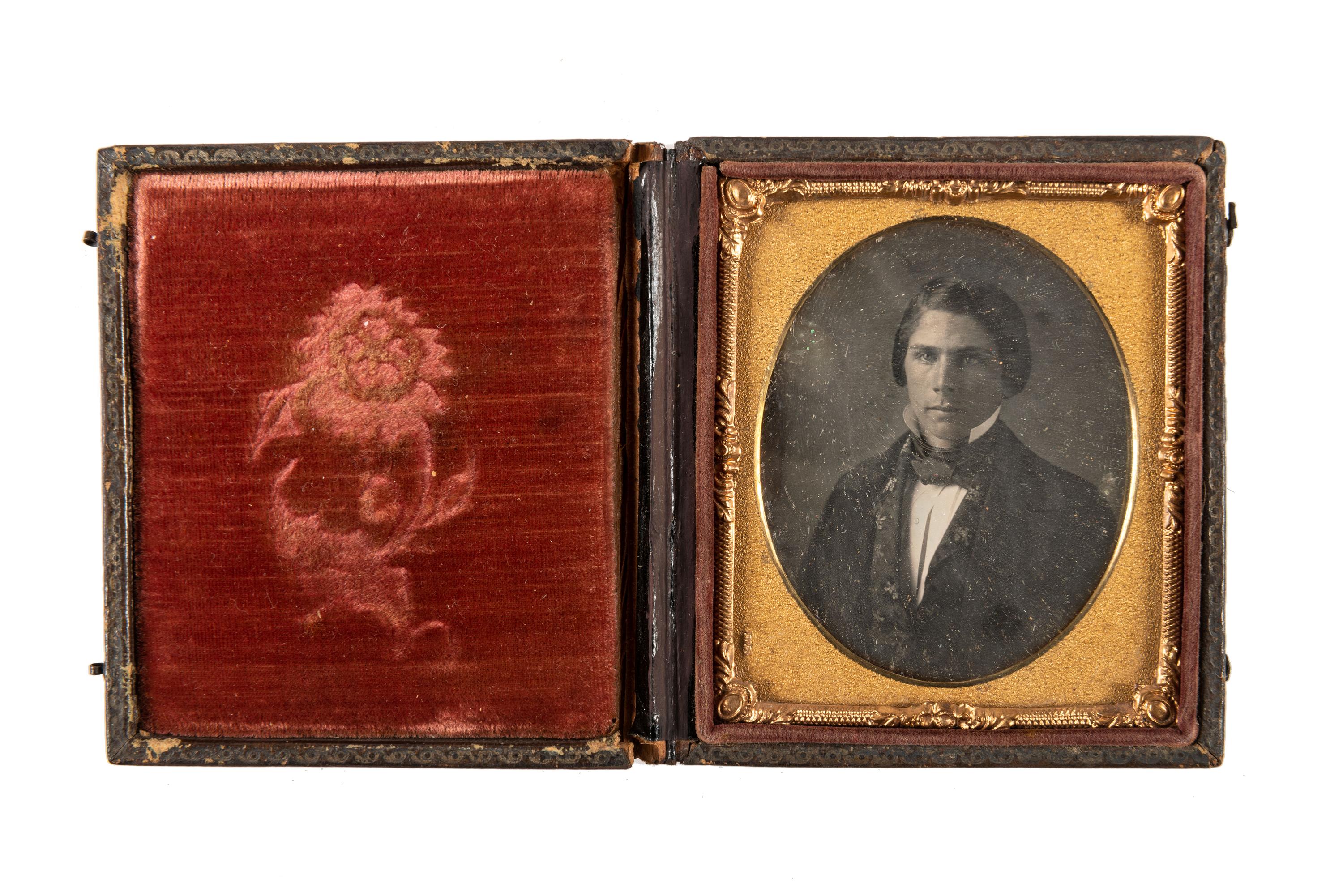 [EARLY PHOTOGRAPHY]. A group of daguerreotype portraits, incl. pendant, possible Hawaiian subject, and case featuring portrait of Daguerre.