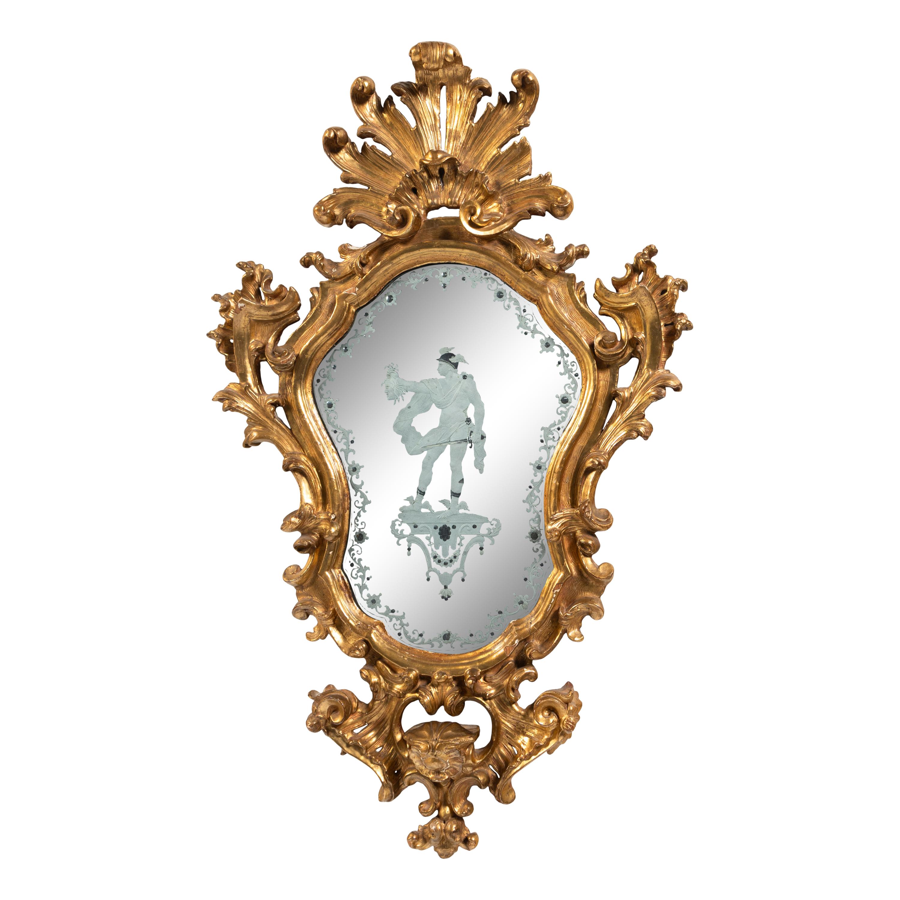An Italian Baroque Style Giltwood and Etched Glass Mirror