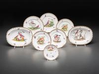 An English Parcel Gilt Bird and Insect Decorated Porcelain Partial Dinner Service