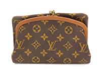 A Louis Vuitton Monogram Canvas Foldover Clutch, 8" x 5".