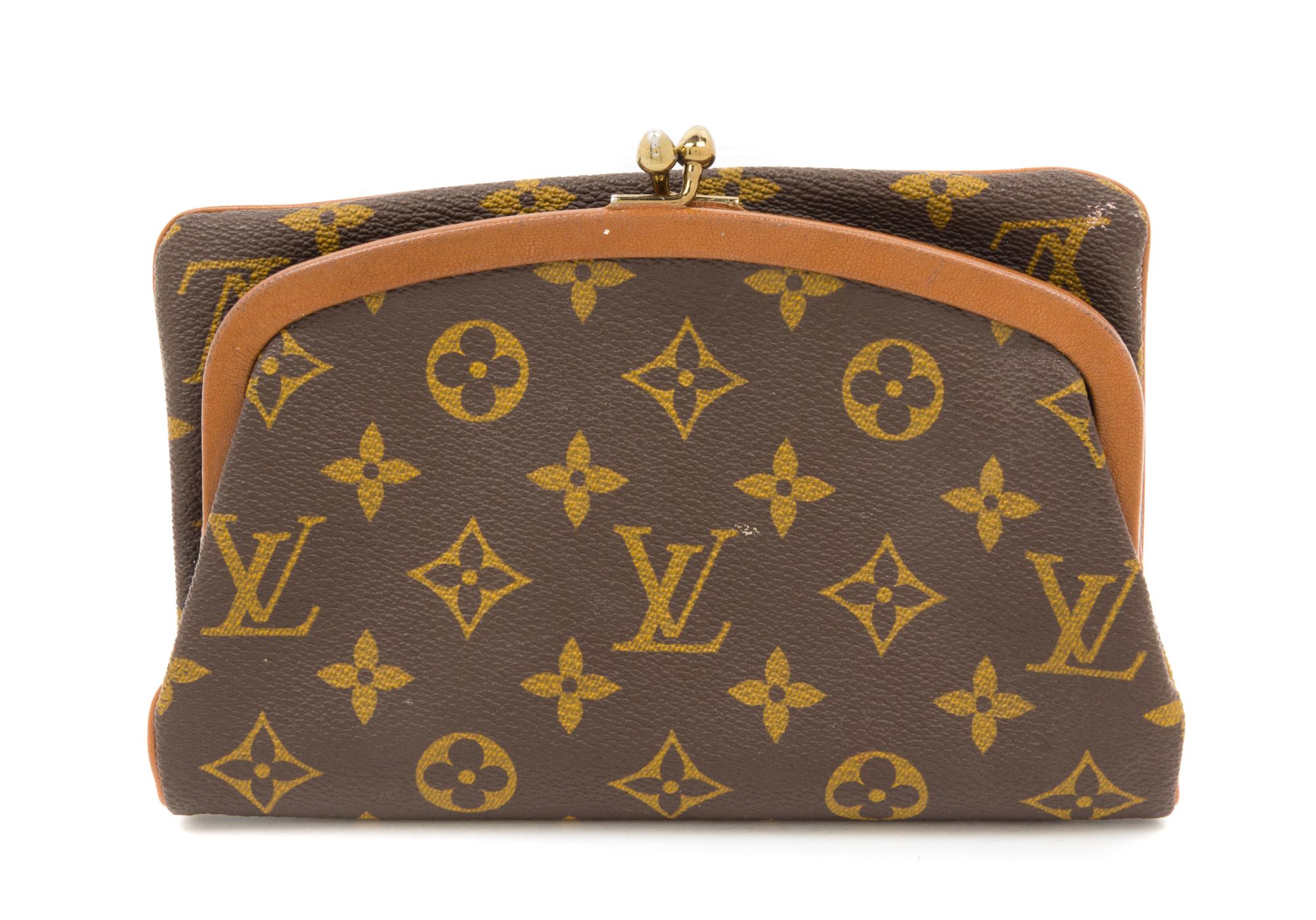 A Louis Vuitton Monogram Canvas Foldover Clutch, 8" x 5".