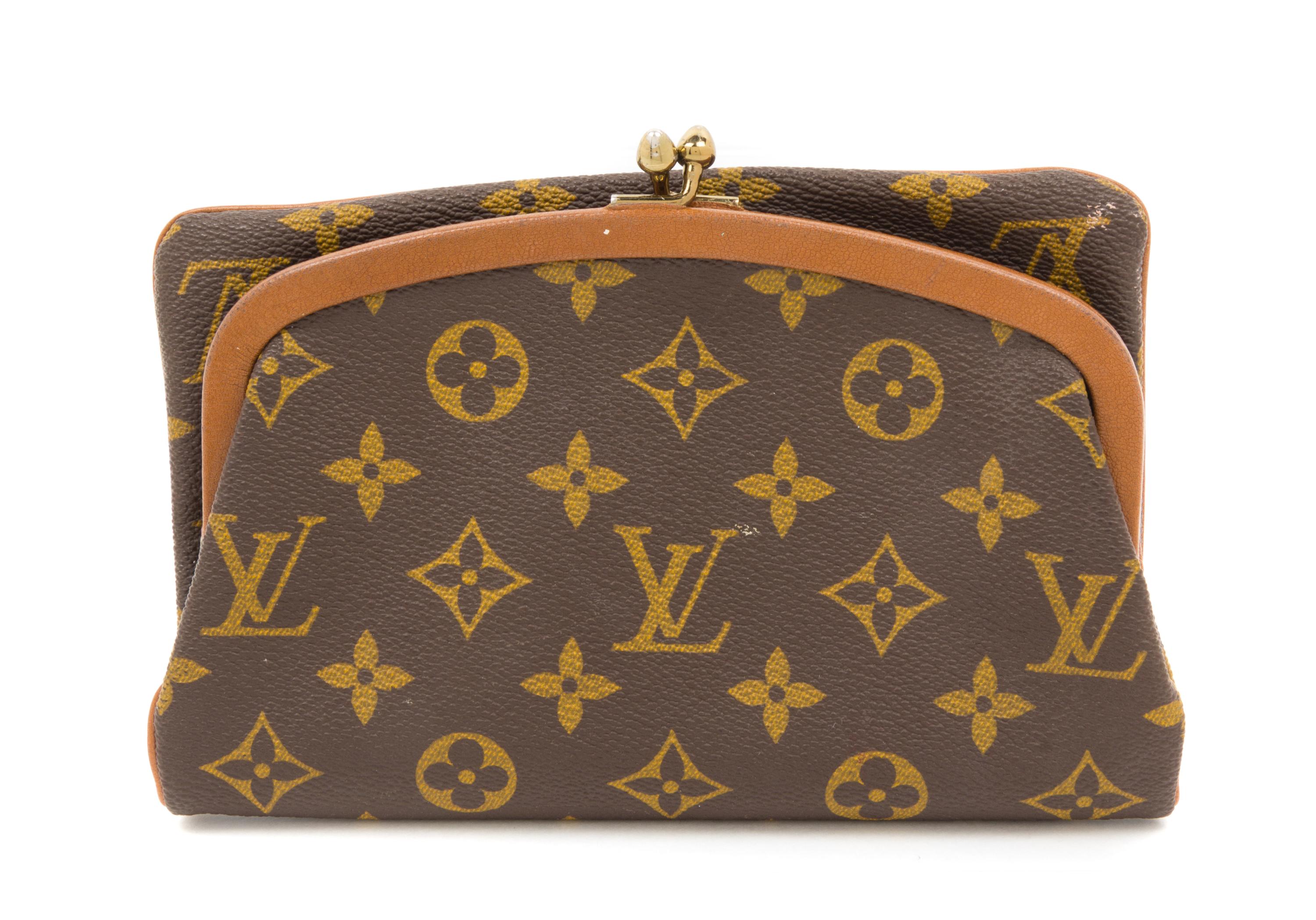 A Louis Vuitton Monogram Canvas Foldover Clutch, 8" x 5".
