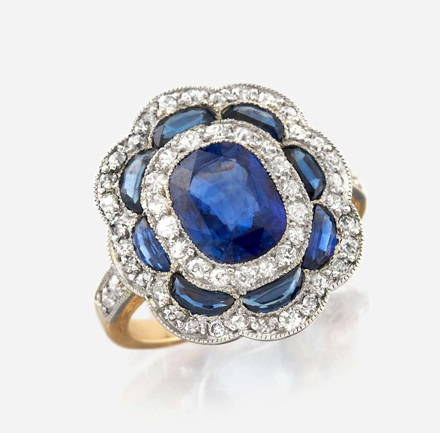 A sapphire, diamond, and platinum topped gold ring
