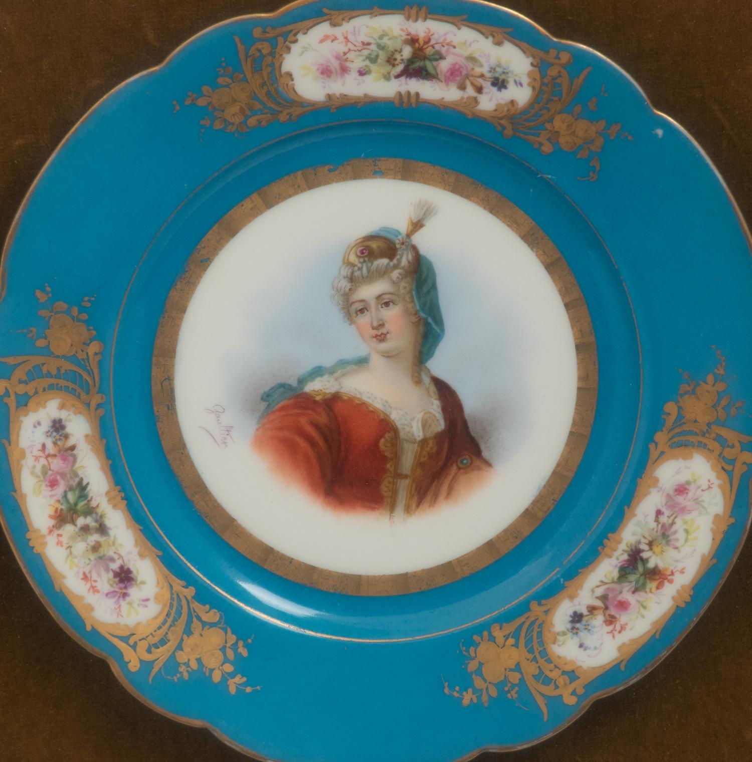 A Group of Seven Framed Sèvres Style Porcelain Plates