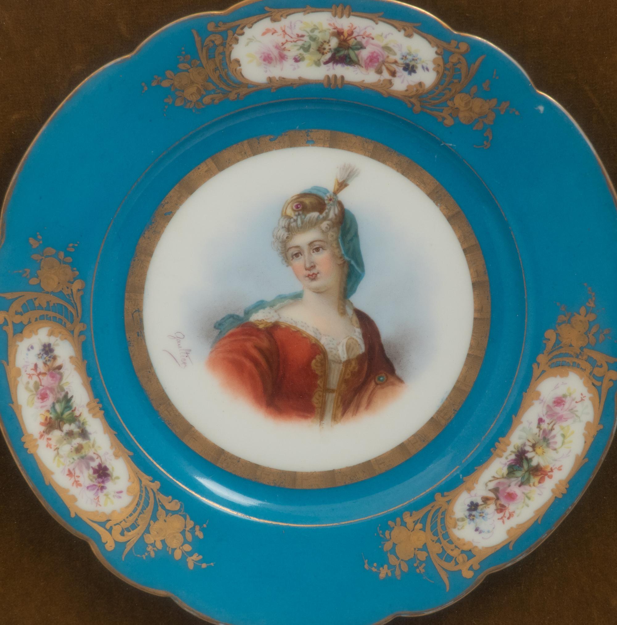 A Group of Seven Framed Sèvres Style Porcelain Plates