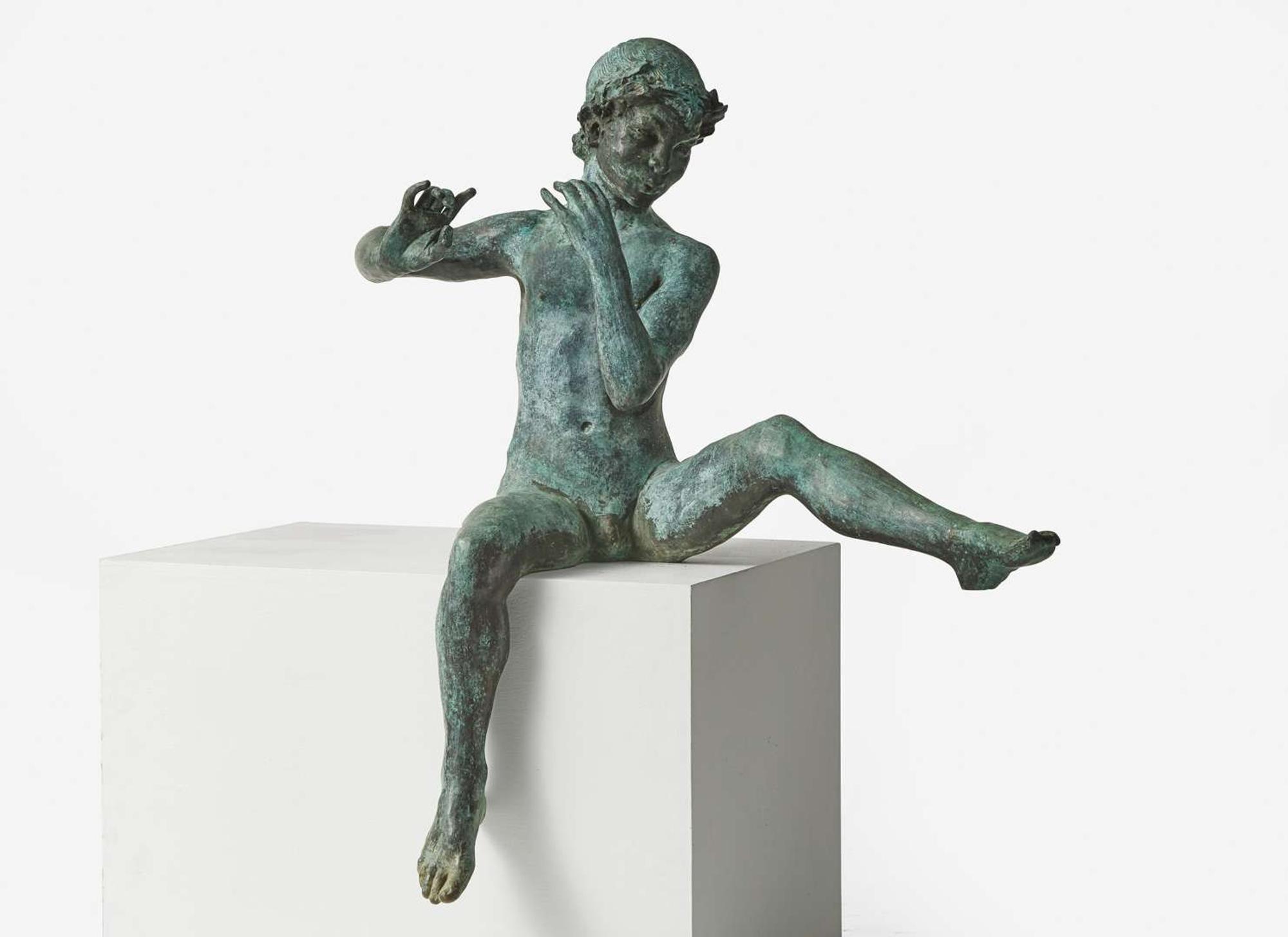 A bronze garden statue of Pan