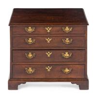 A George III Diminutive Lift-Top Chest of Drawers
