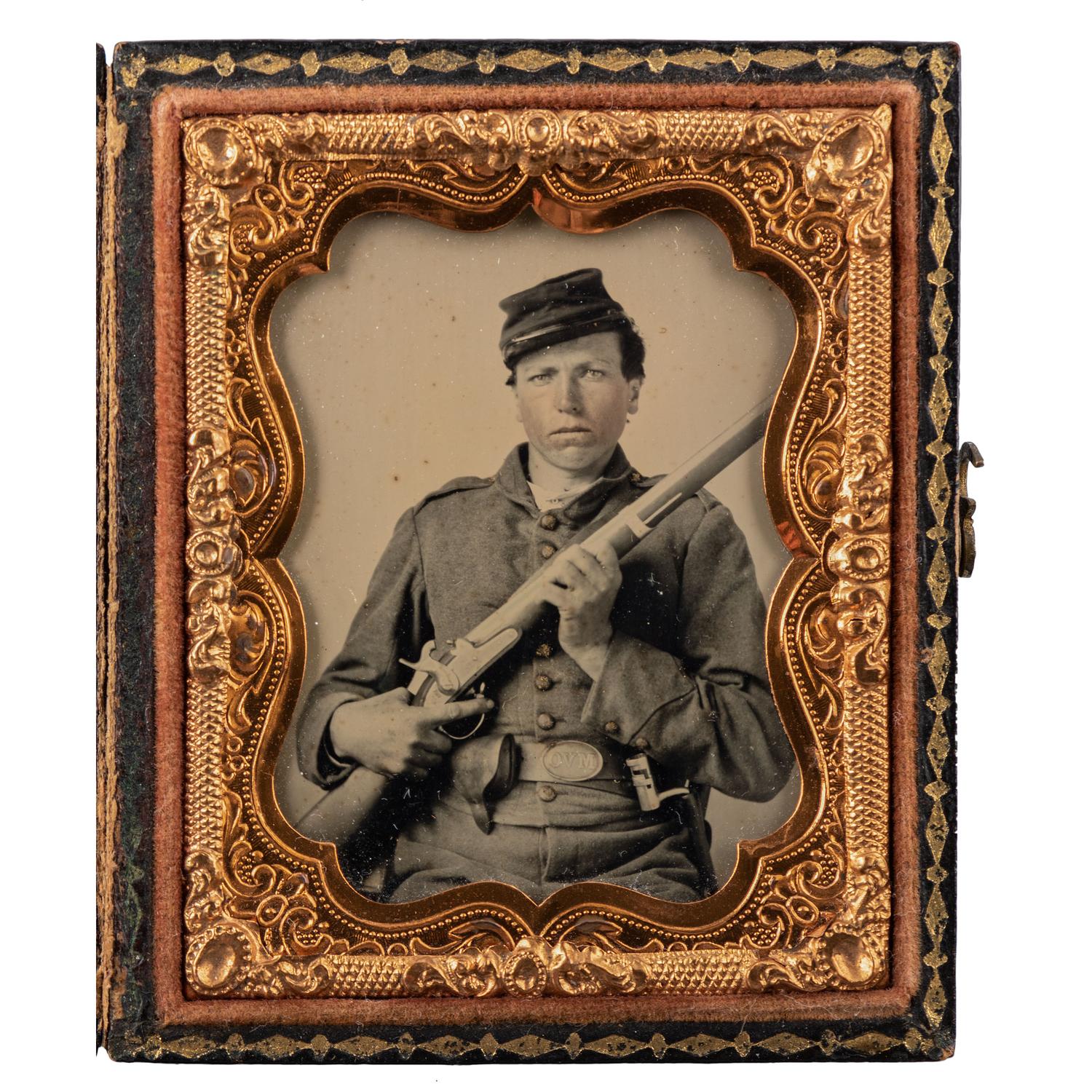 Ninth plate ambrotype of double-armed Ohio volunteer infantryman wearing "OVM" belt plate.
