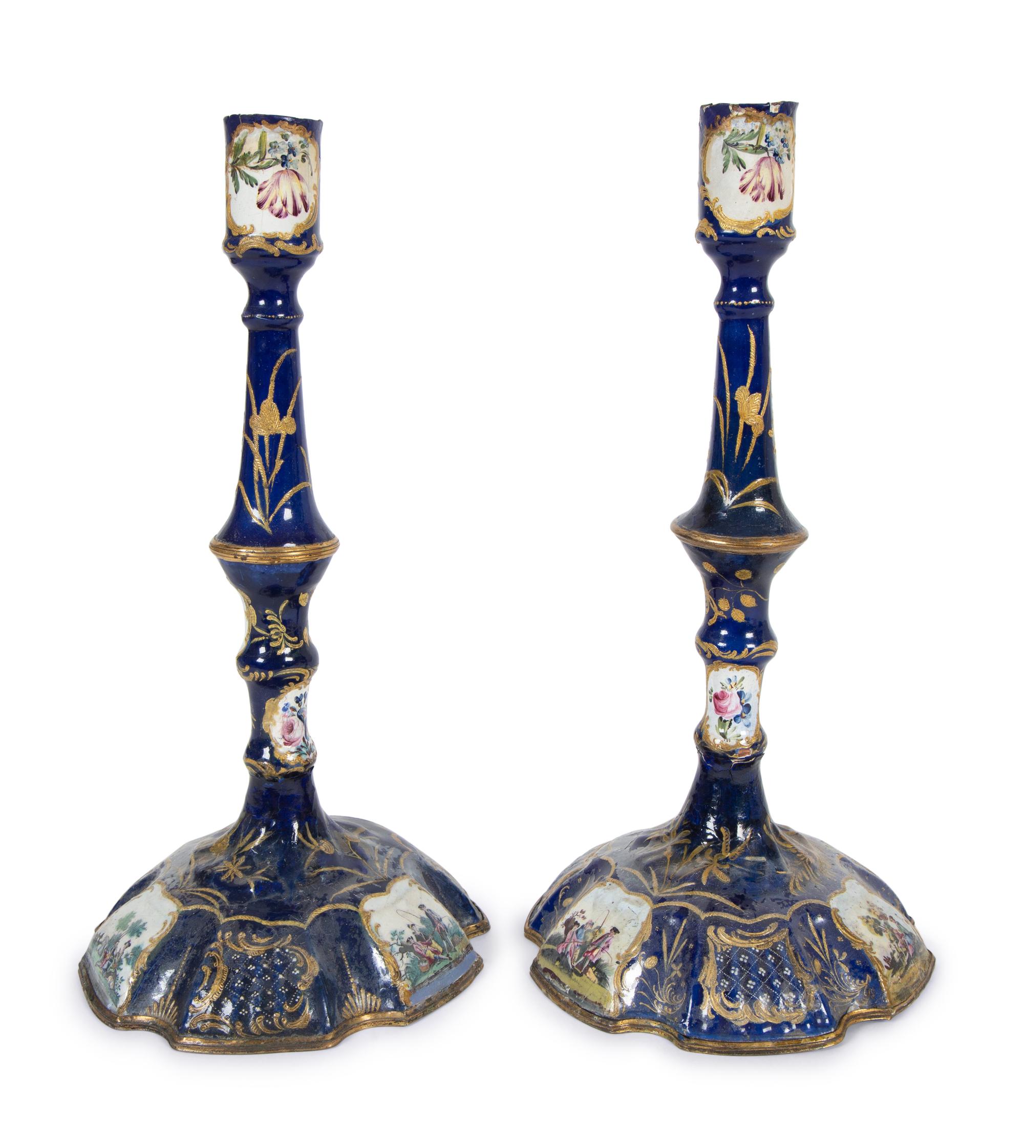A Pair of Battersea Enamel Candlesticks