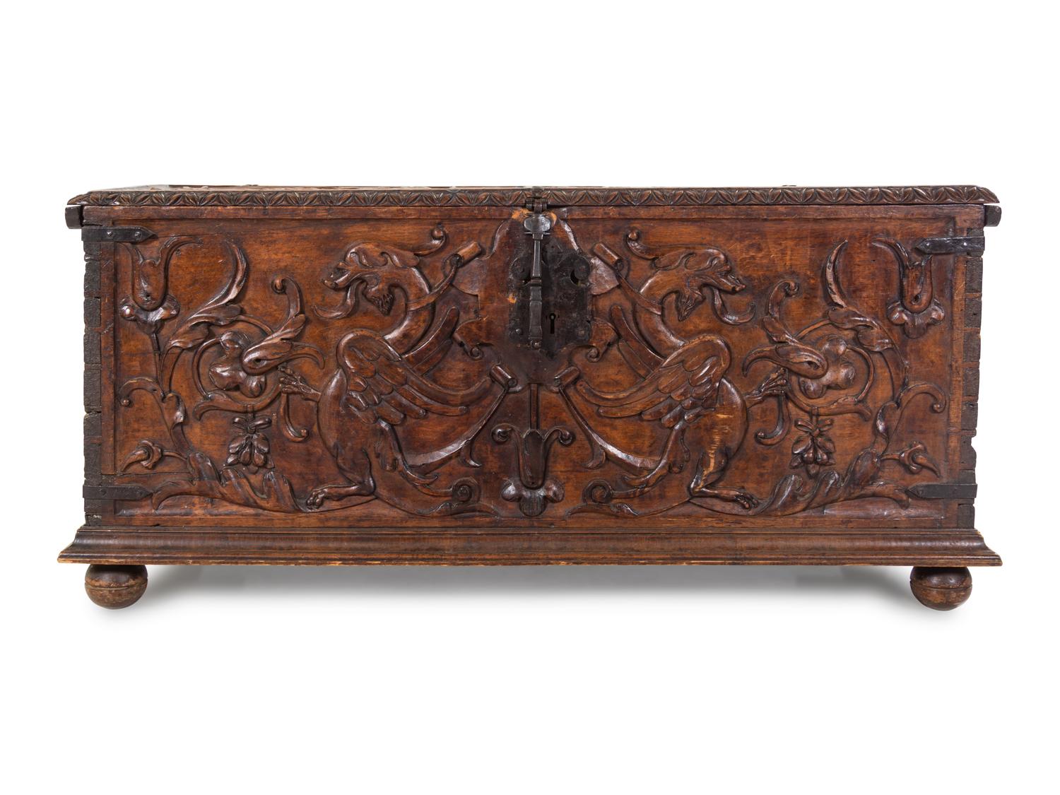 A Continental Carved Walnut Cassone