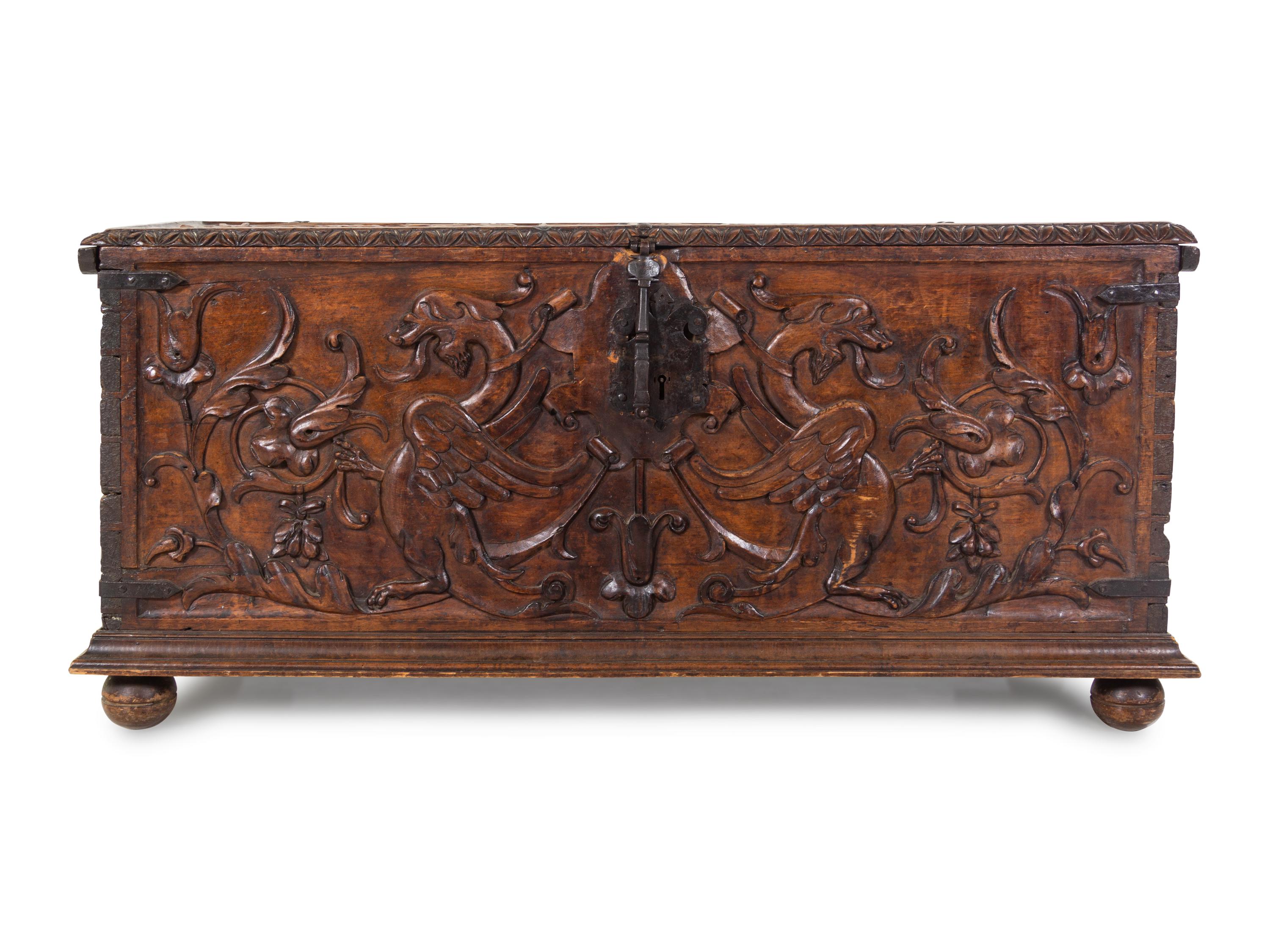 A Continental Carved Walnut Cassone
