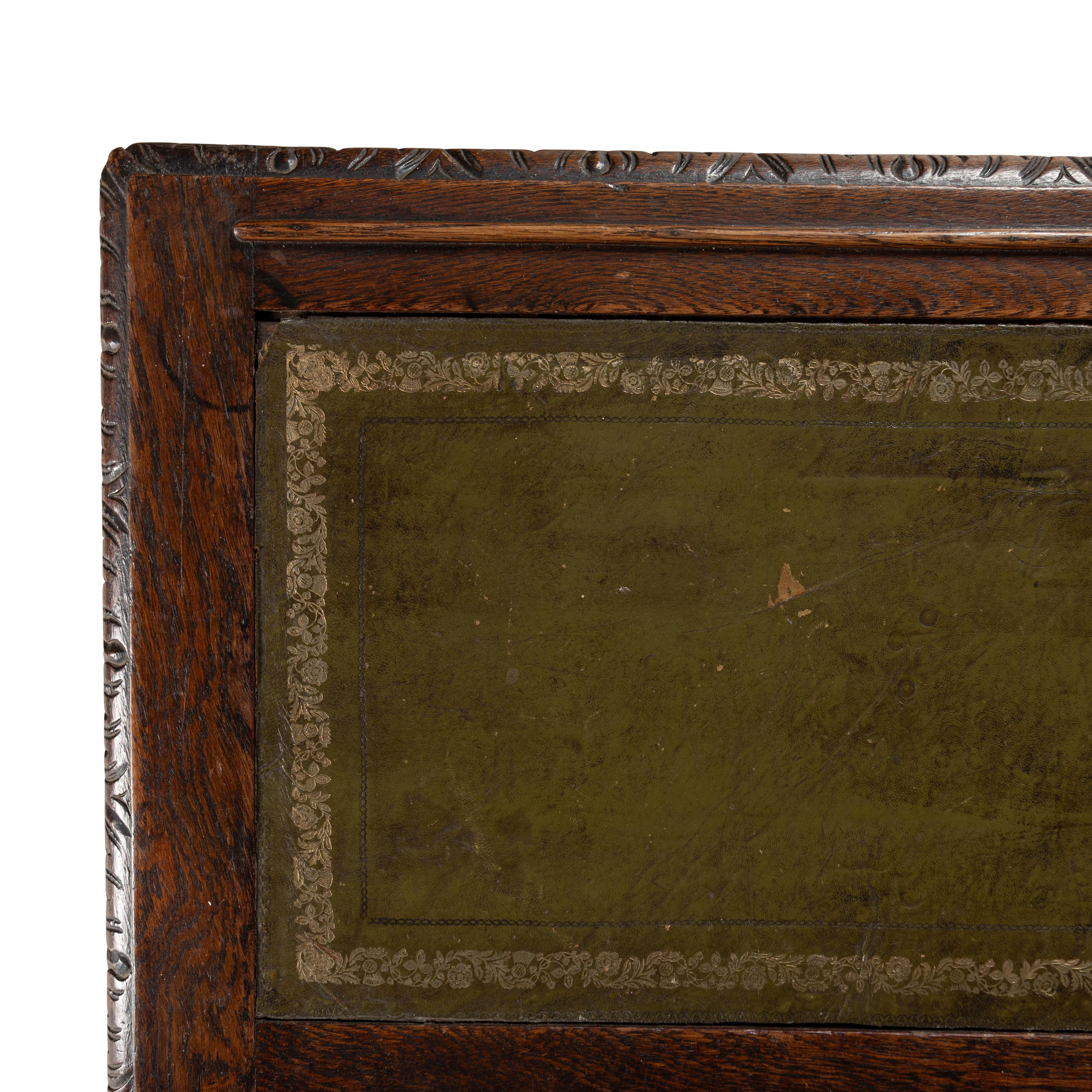 An Italian Carved Oak Writing Desk