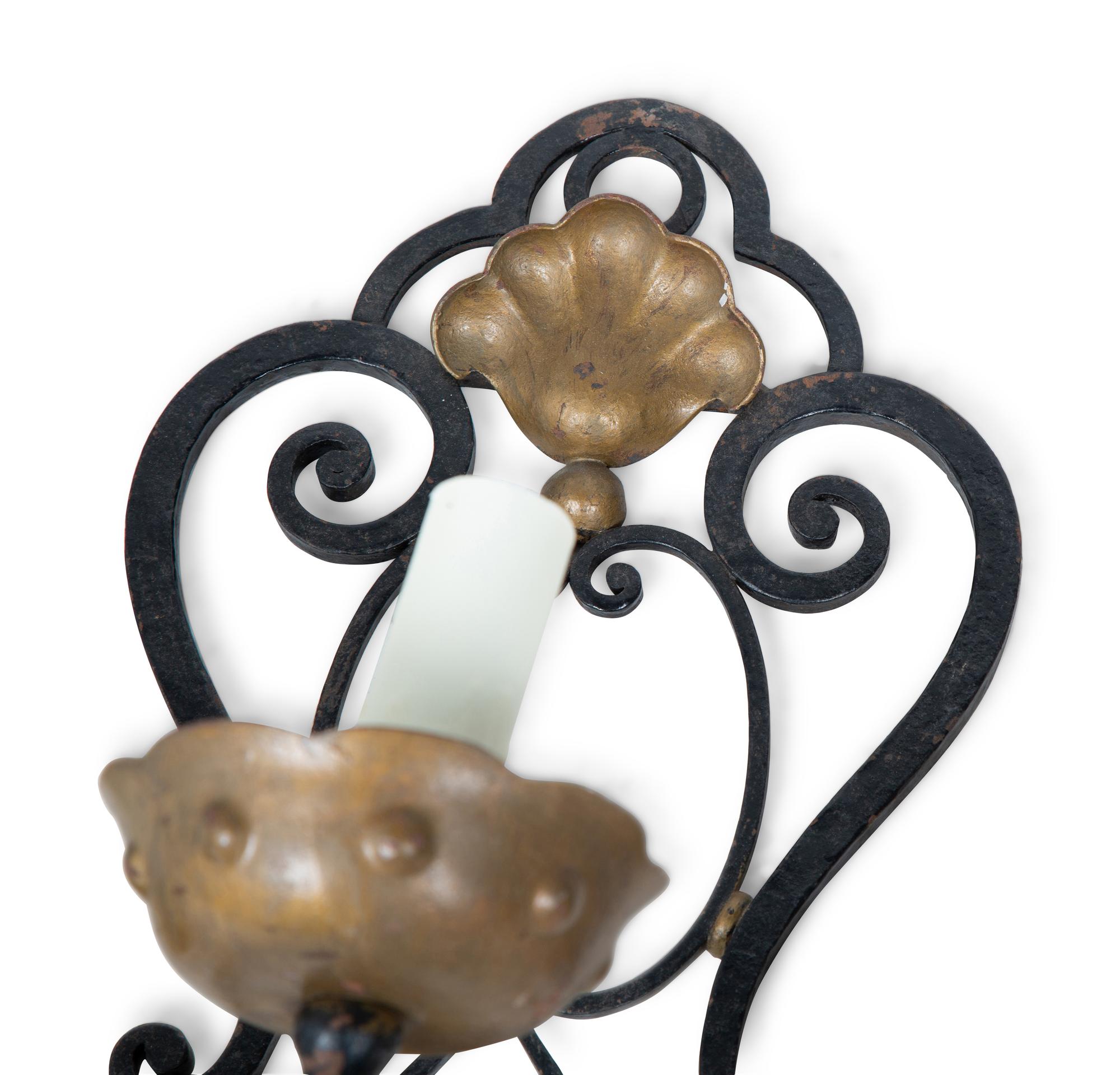 A Pair of French Wrought Iron Three-Arm Sconces