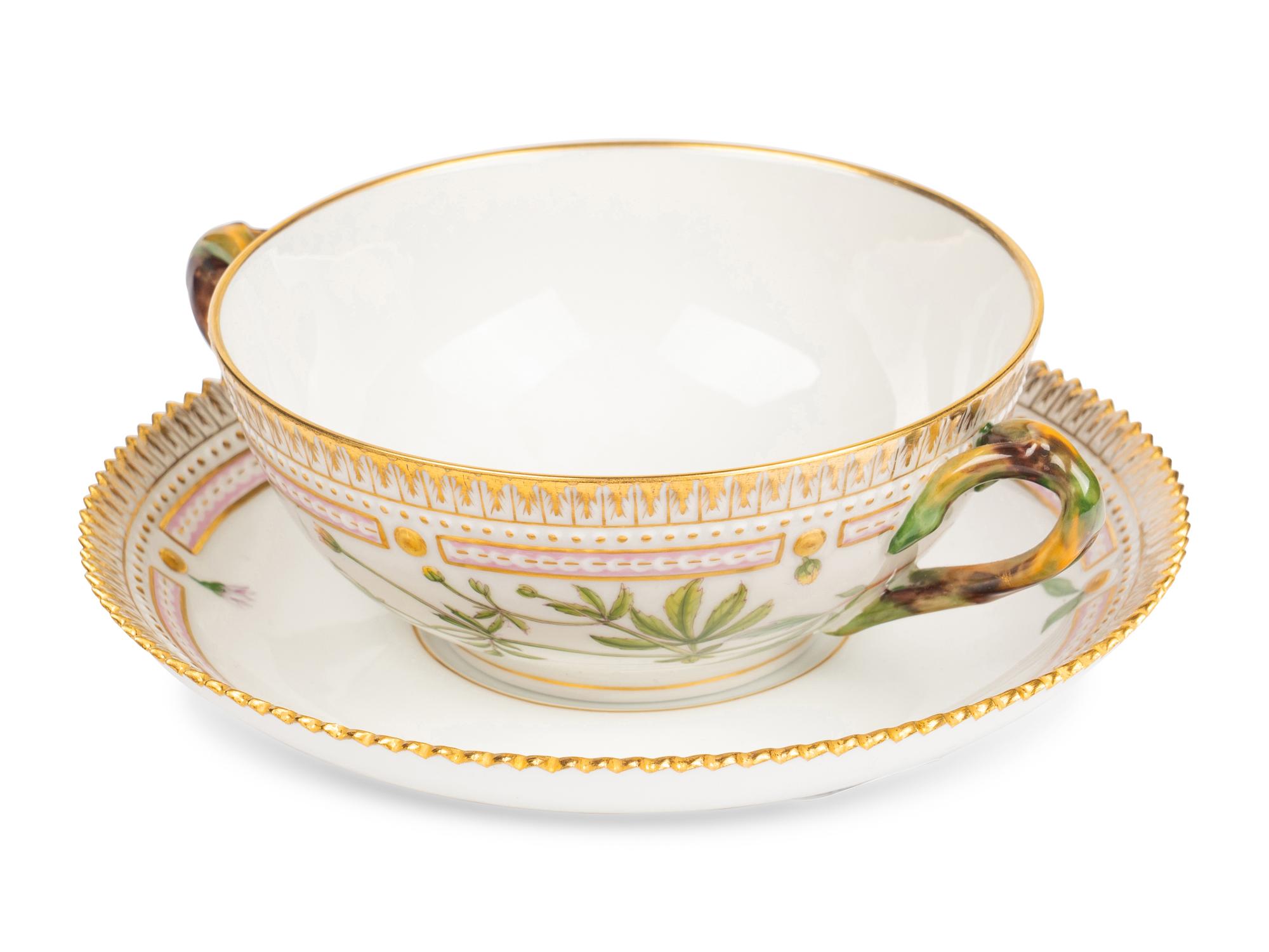 A Set of Twelve Royal Copenhagen Flora Danica Porcelain Bouillon Cups and Stands