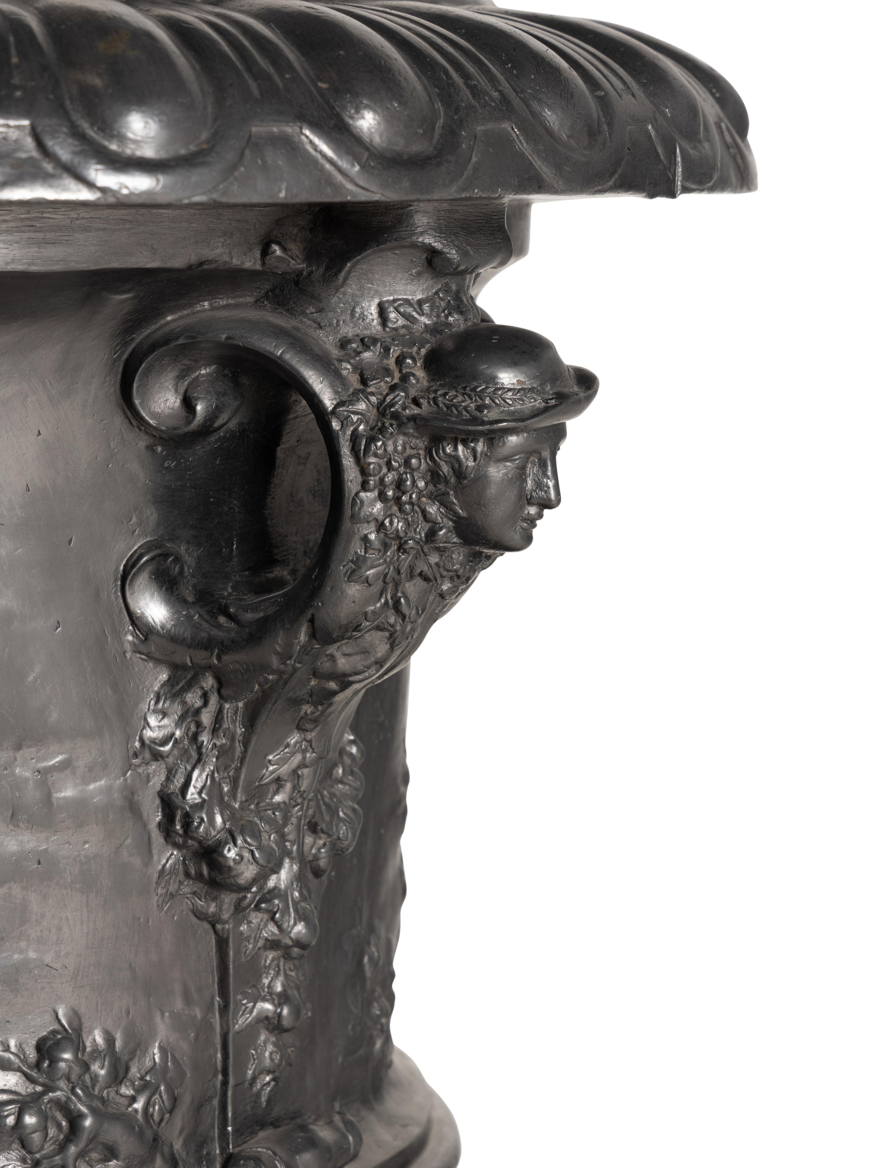 A Pair of English Lead Allegorical Garden Urns