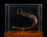 A Japanese Bronze Stirrup in a Walnut and Acrylic Pedestal Vitrine