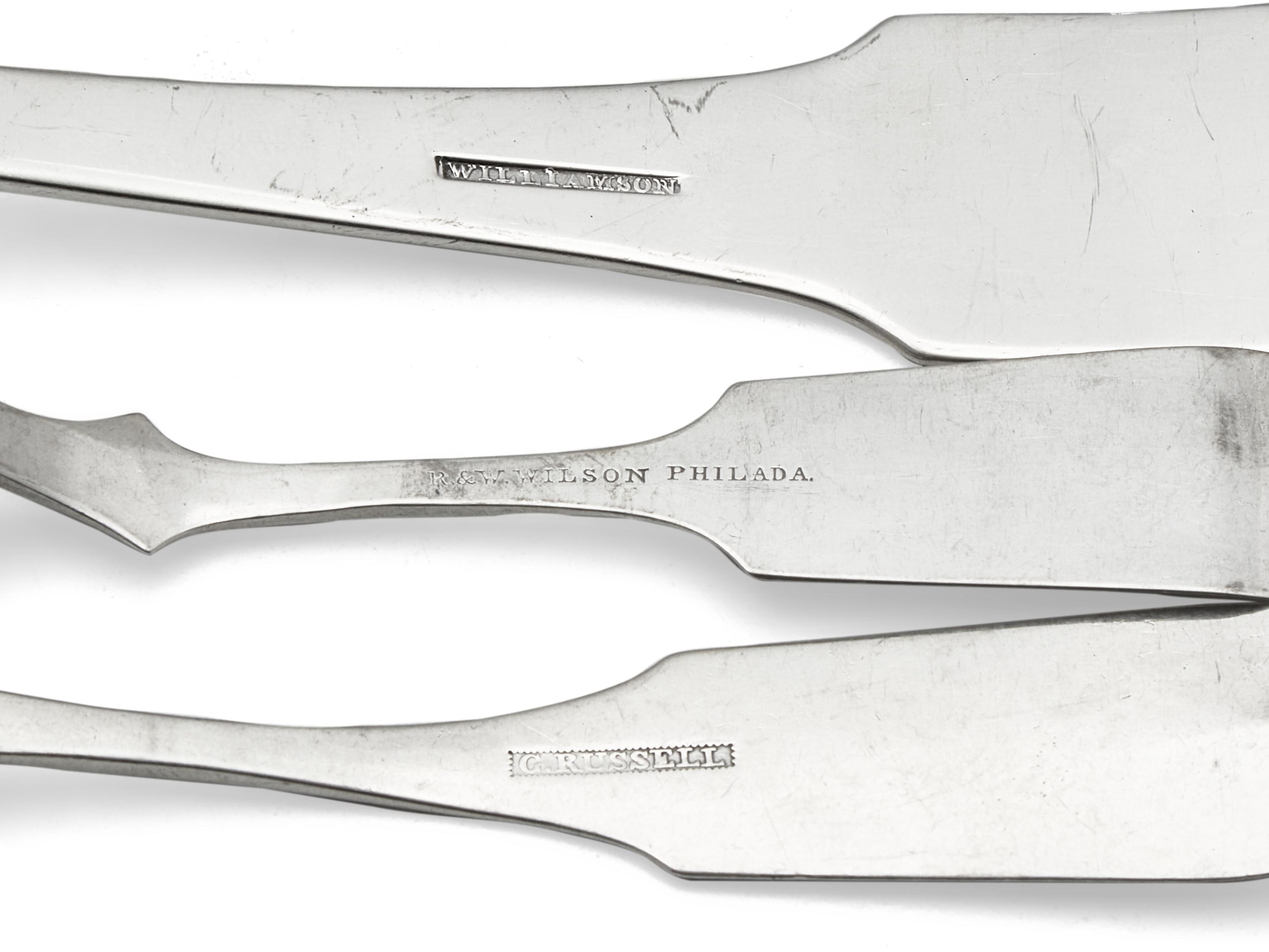 A Group of Eight Coin Silver Fiddle-Back Serving Articles