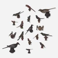 A group of seventeen carved and painted wood birds or bird groups