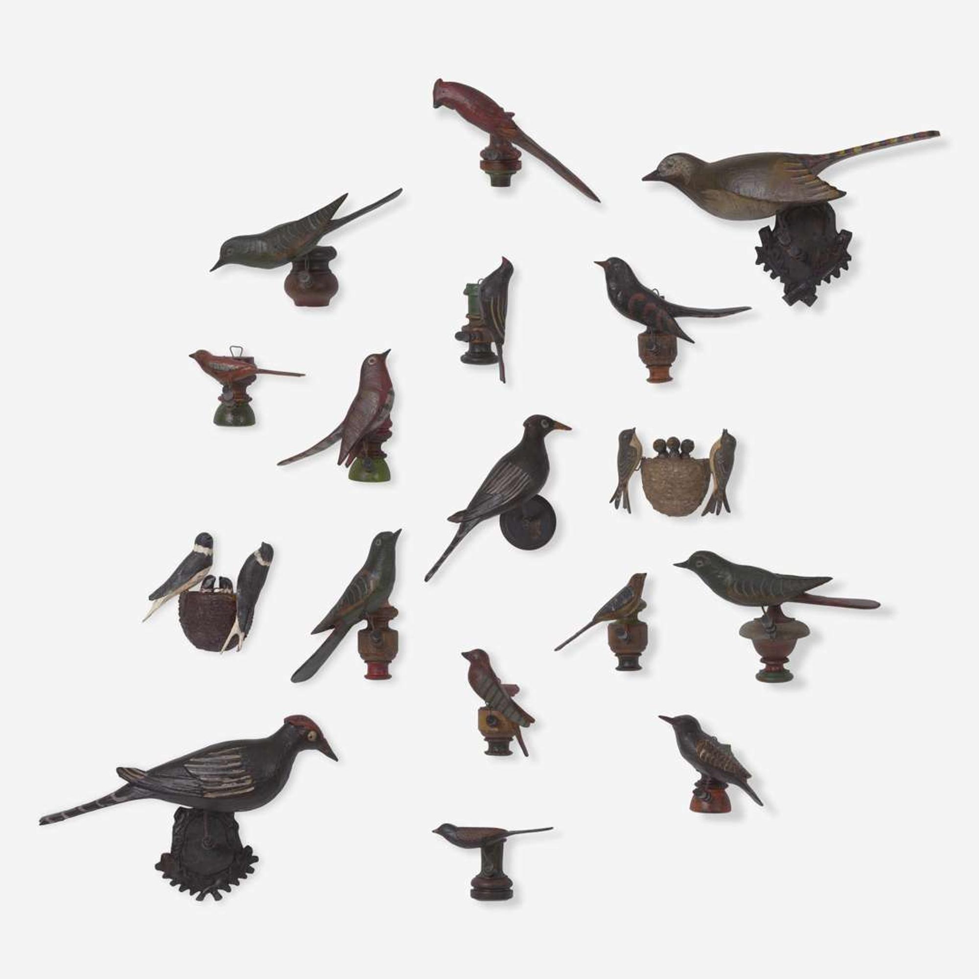 A group of seventeen carved and painted wood birds or bird groups