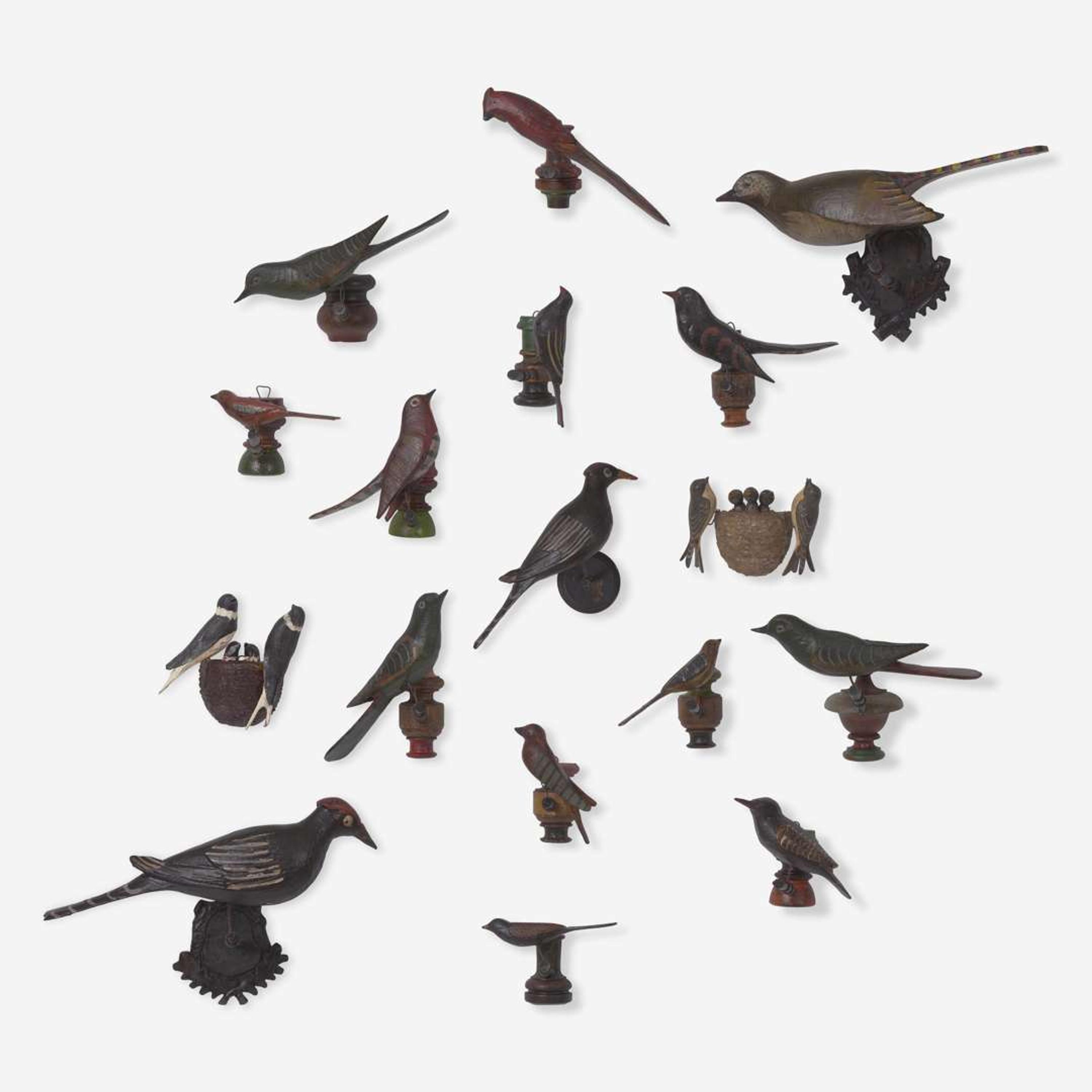 A group of seventeen carved and painted wood birds or bird groups