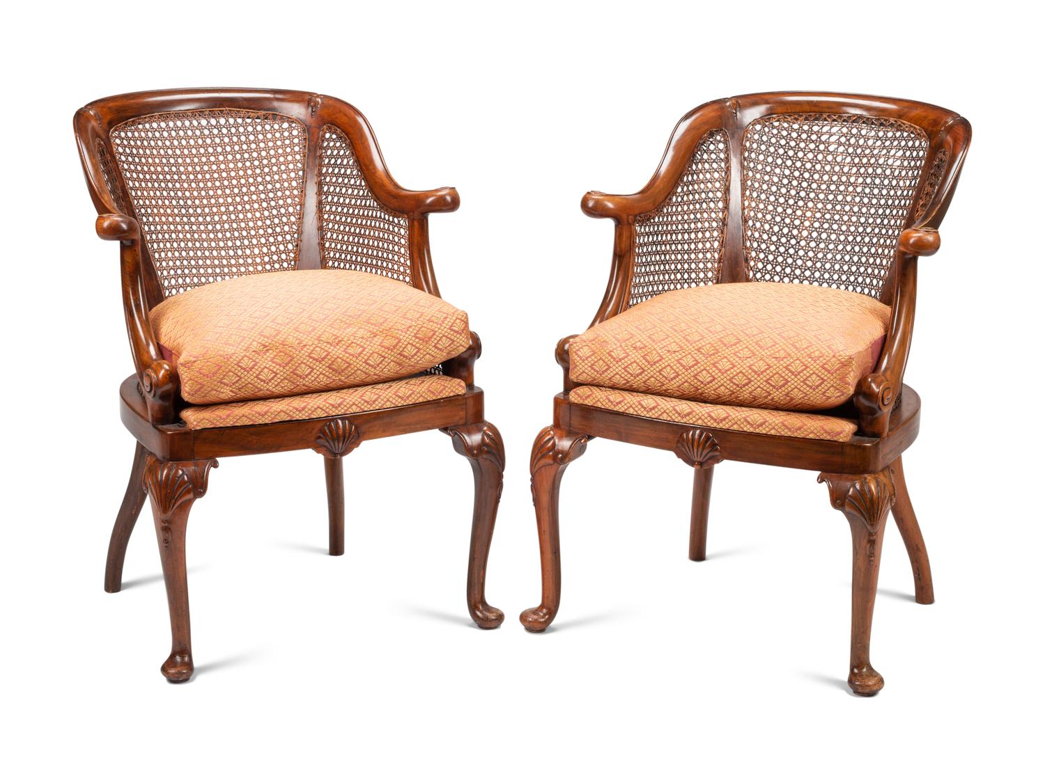 A Pair of English Walnut Barrel-Back Armchairs