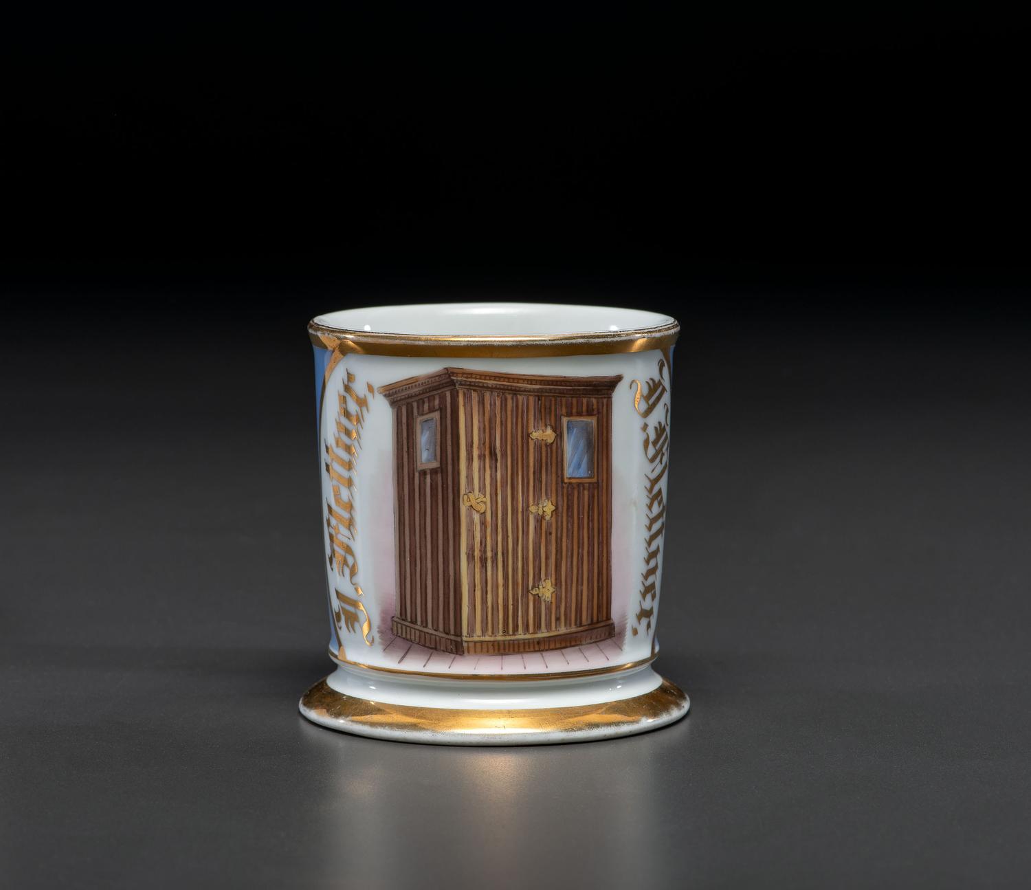 An Unusual Porcelain Shaving Mug Depicting an Icehouse