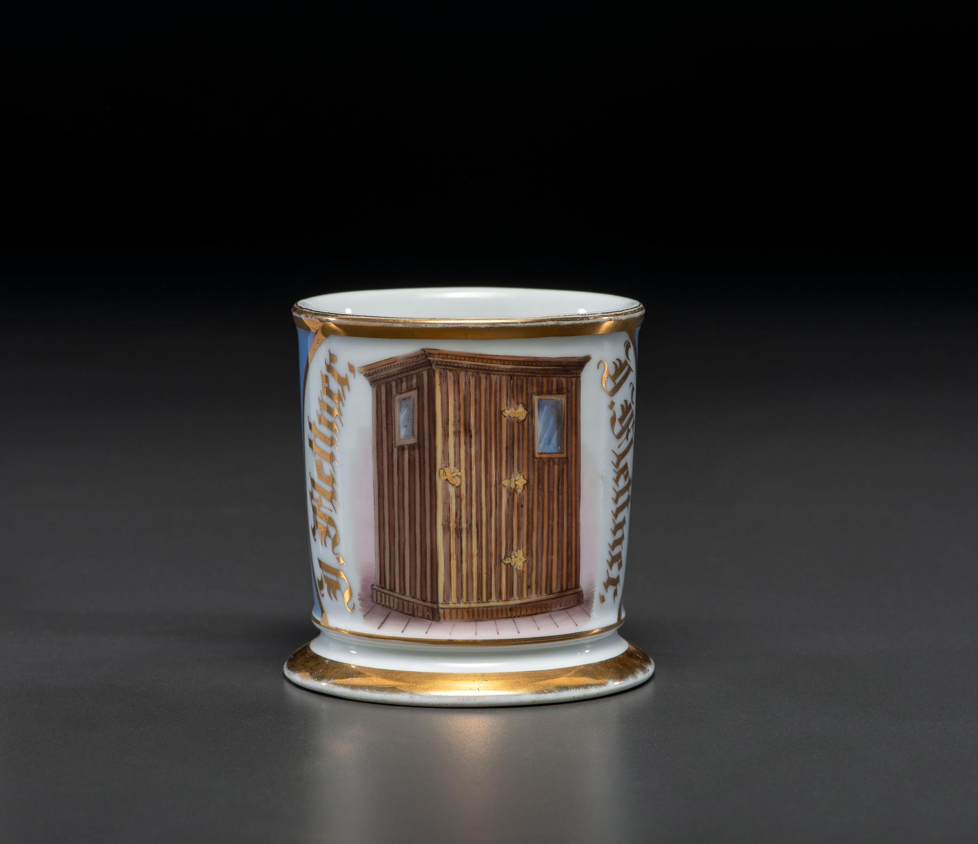 An Unusual Porcelain Shaving Mug Depicting an Icehouse