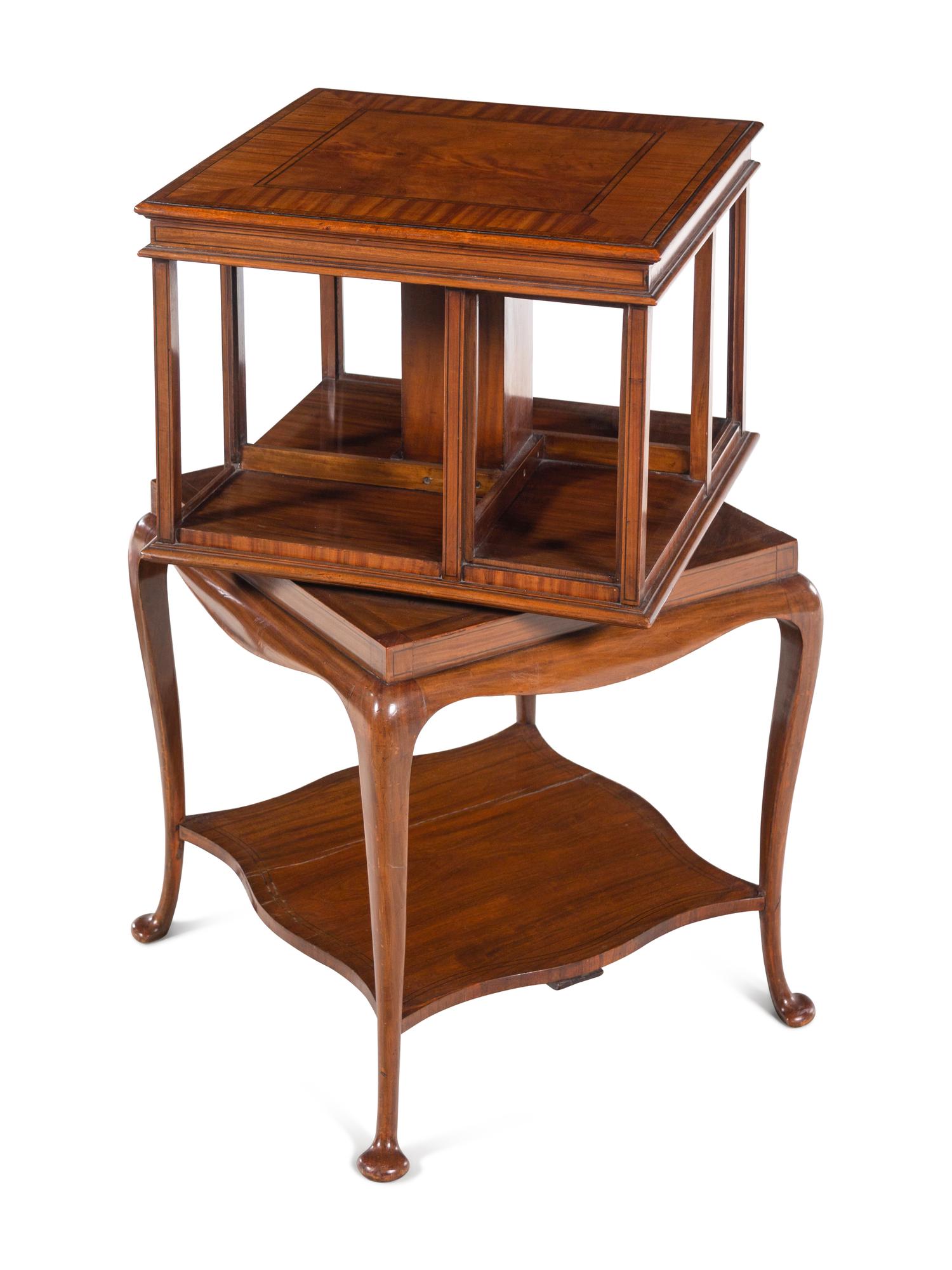 A Pair of Edwardian Satinwood and Mahogany Revolving Bookcases