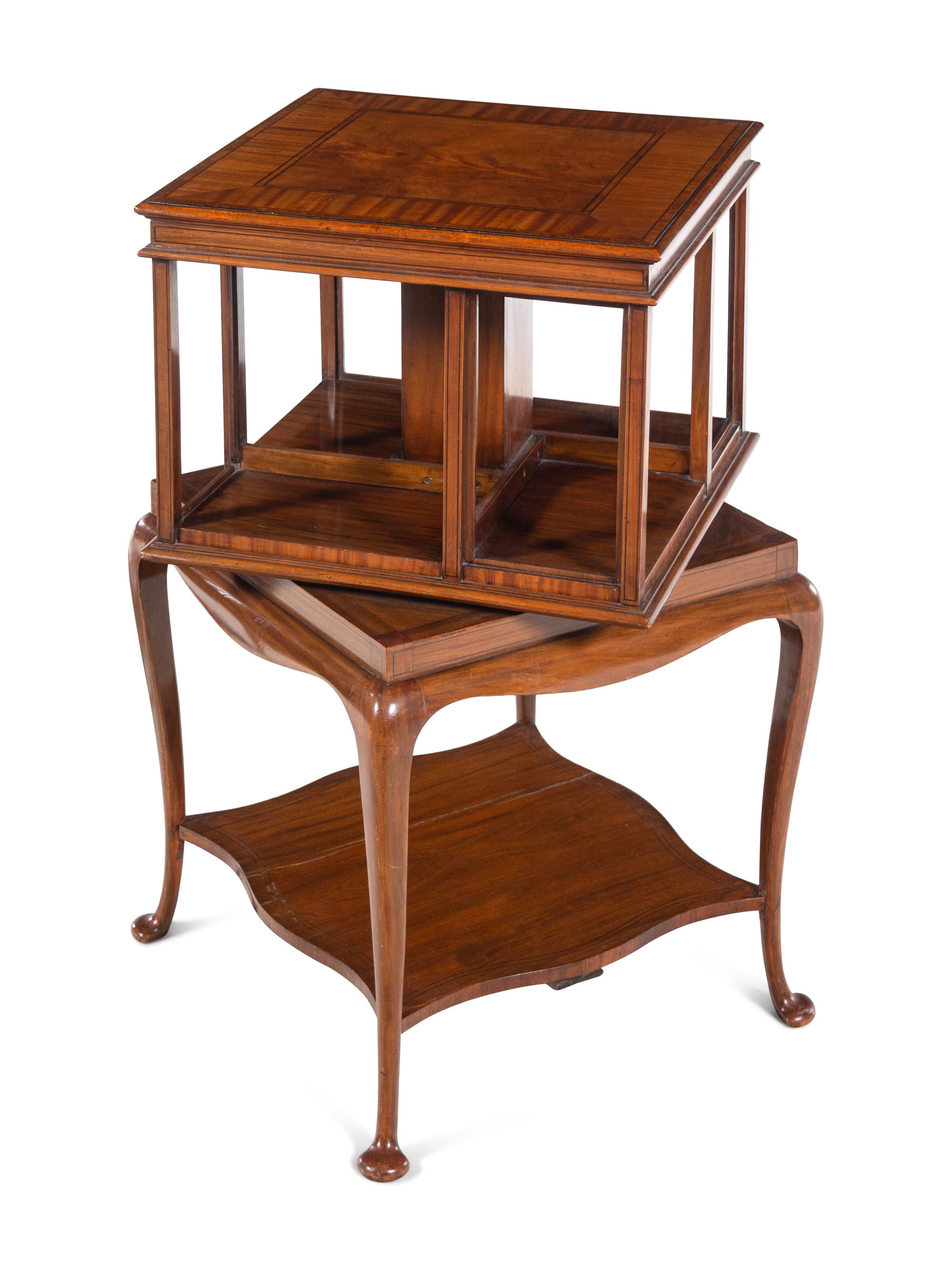 A Pair of Edwardian Satinwood and Mahogany Revolving Bookcases
