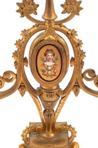 A French Neoclassical Gilt Bronze and Porcelain Plaque-Inset Clock Garniture
