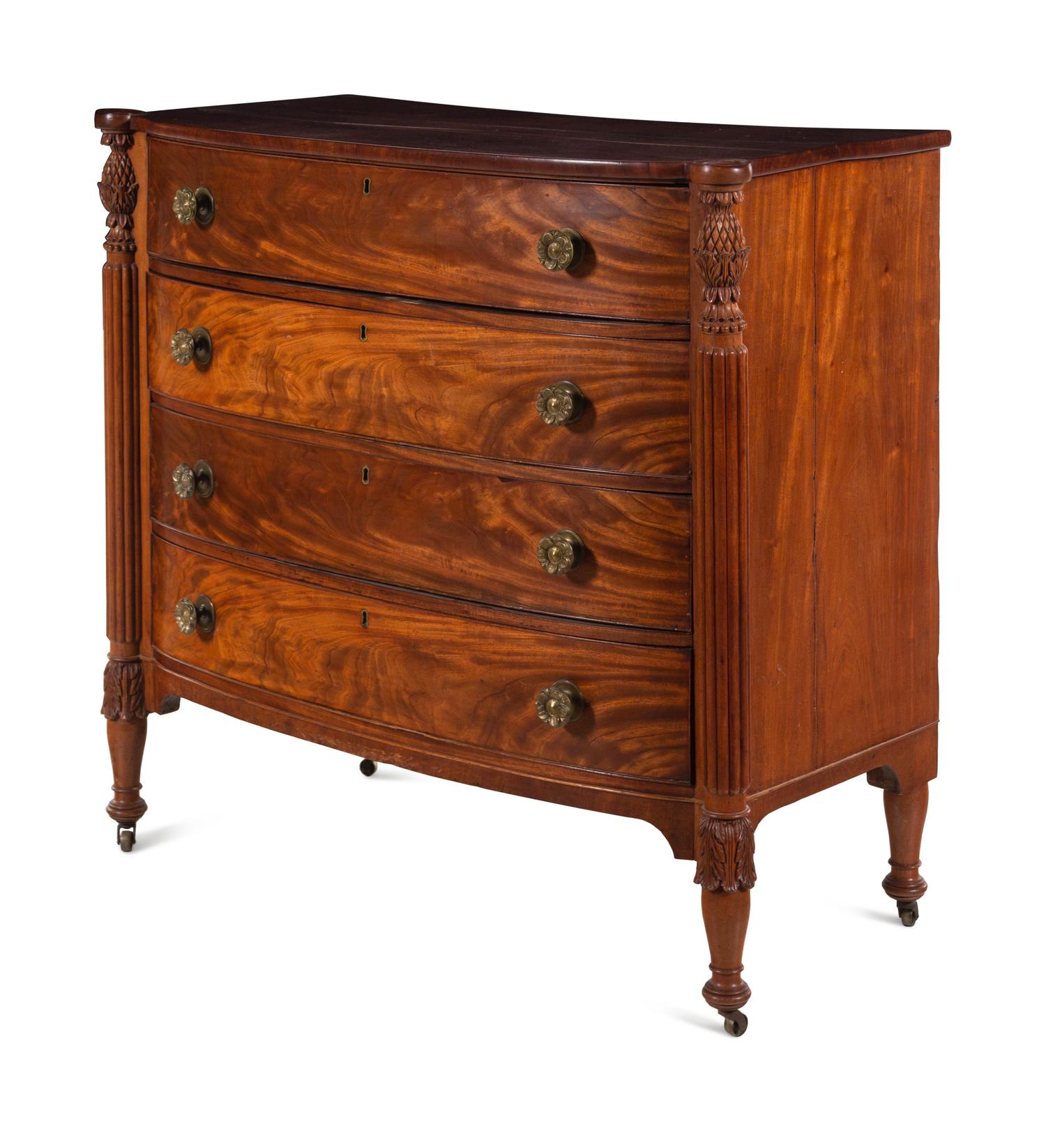 A Federal Carved and Figured Mahogany Bow-Front Chest of Drawers