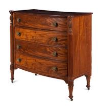 A Federal Carved and Figured Mahogany Bow-Front Chest of Drawers
