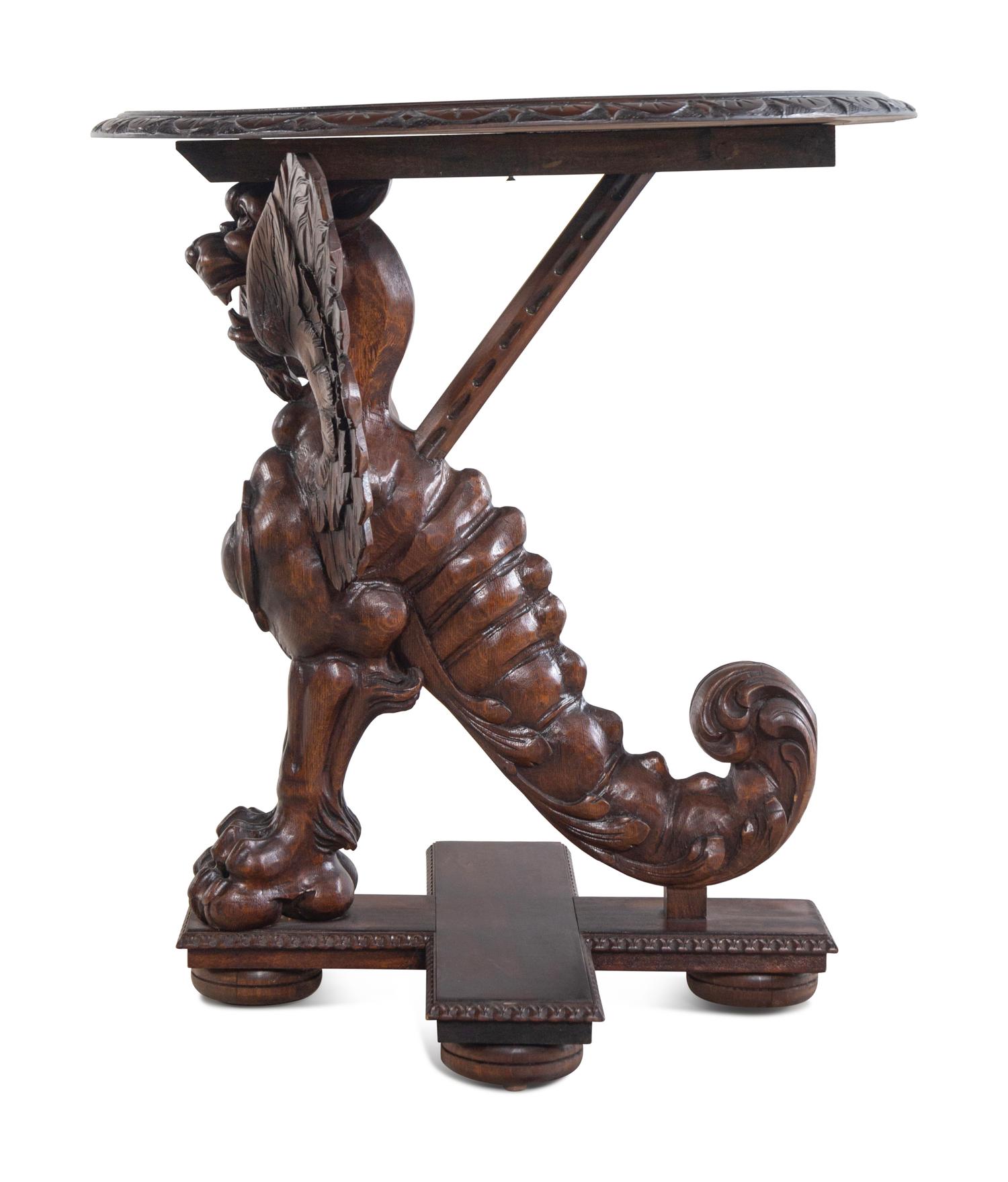 A Pair of Continental Baroque Style Carved Walnut Griffin Tables