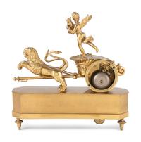 A French Ormolu Mantle Clock in the Form of a Chariot with Apollo and Lions