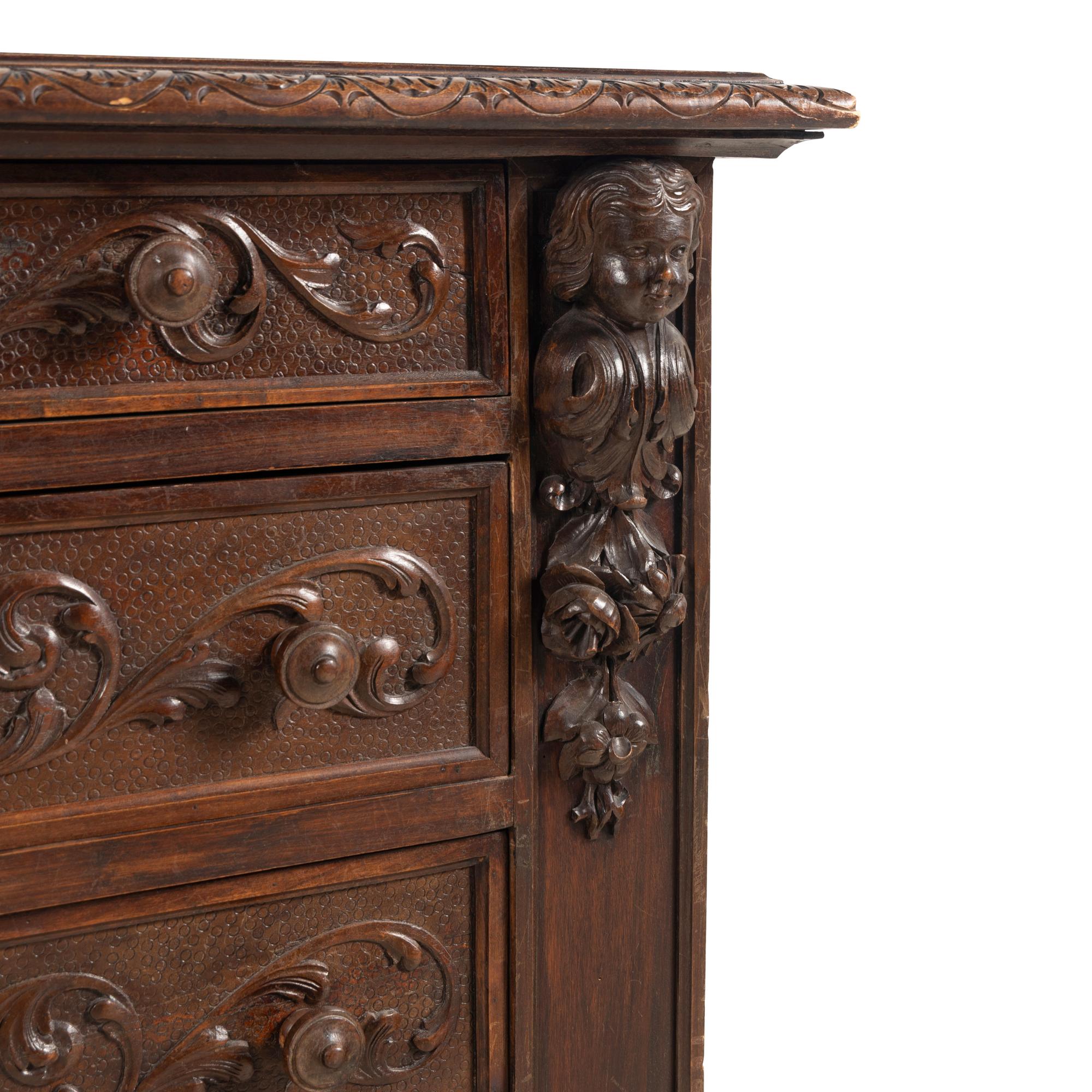 A Spanish Carved Oak Chest of Drawers