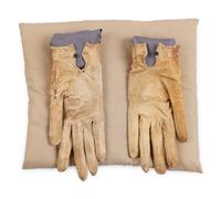 [LINCOLN ASSASSINATION]. A pair of stained leather gloves carried by President Abraham Lincoln at Ford's Theatre on the night of his assassination, 14 April 1865.