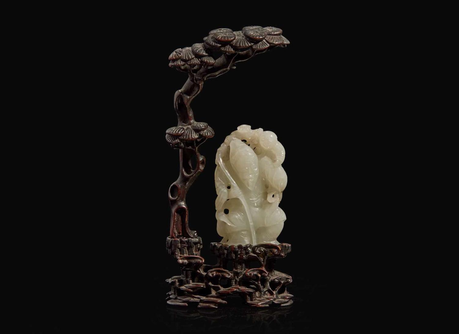 A Chinese white jade figural group with carved hardwood stand 白玉人物與木座